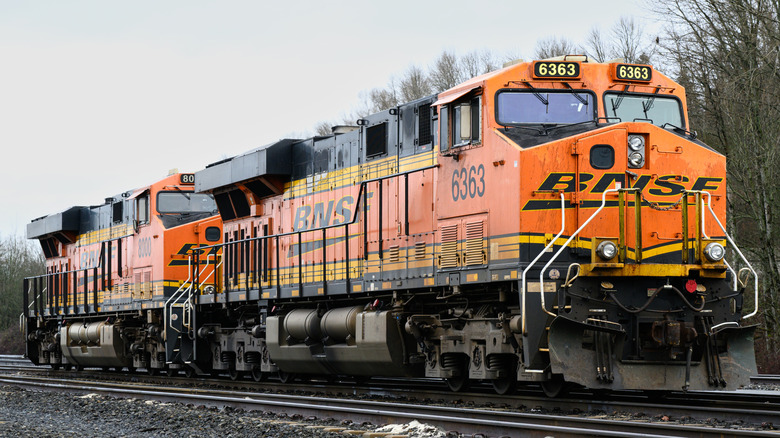 Orange BNSF train on train track