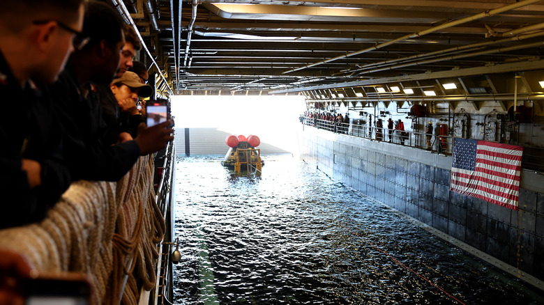 Navy divers secure NASA's Orion Capsule during recovery operations after it splashed down following a successful uncrewed Artemis I Moon Mission on December 11, 2022 seen from aboard the U.S.S. Portland in the Pacific Ocean off the coast of Baja California, Mexico.