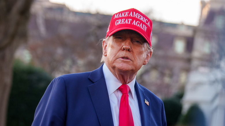 President Donald Trump takes a question from a reporter before boarding Marine One on the South Lawn of the White House on February 28, 2025 in Washington, DC.