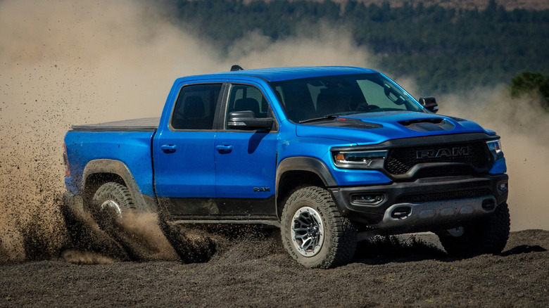 A blue Ram TRX sliding through gravel