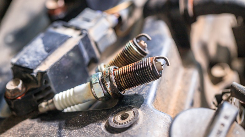 A photo of two old spark plugs.