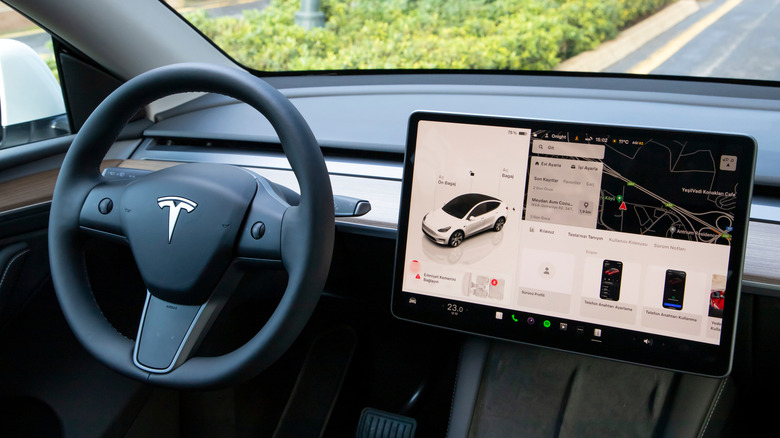 A photo of the dash in a Tesla car.