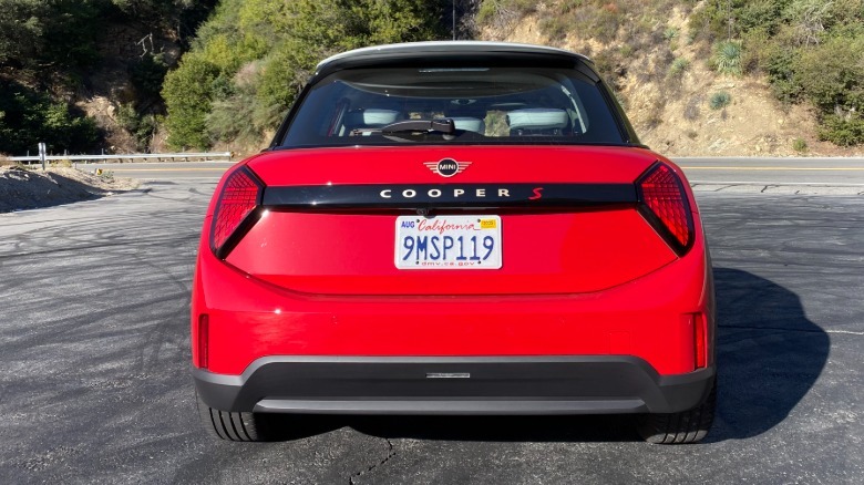 rear view of the red Mini Cooper S in front of a mountain