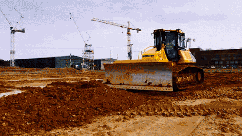 A gif of driver Catie Bunnings behind the wheel of a bulldozer. 