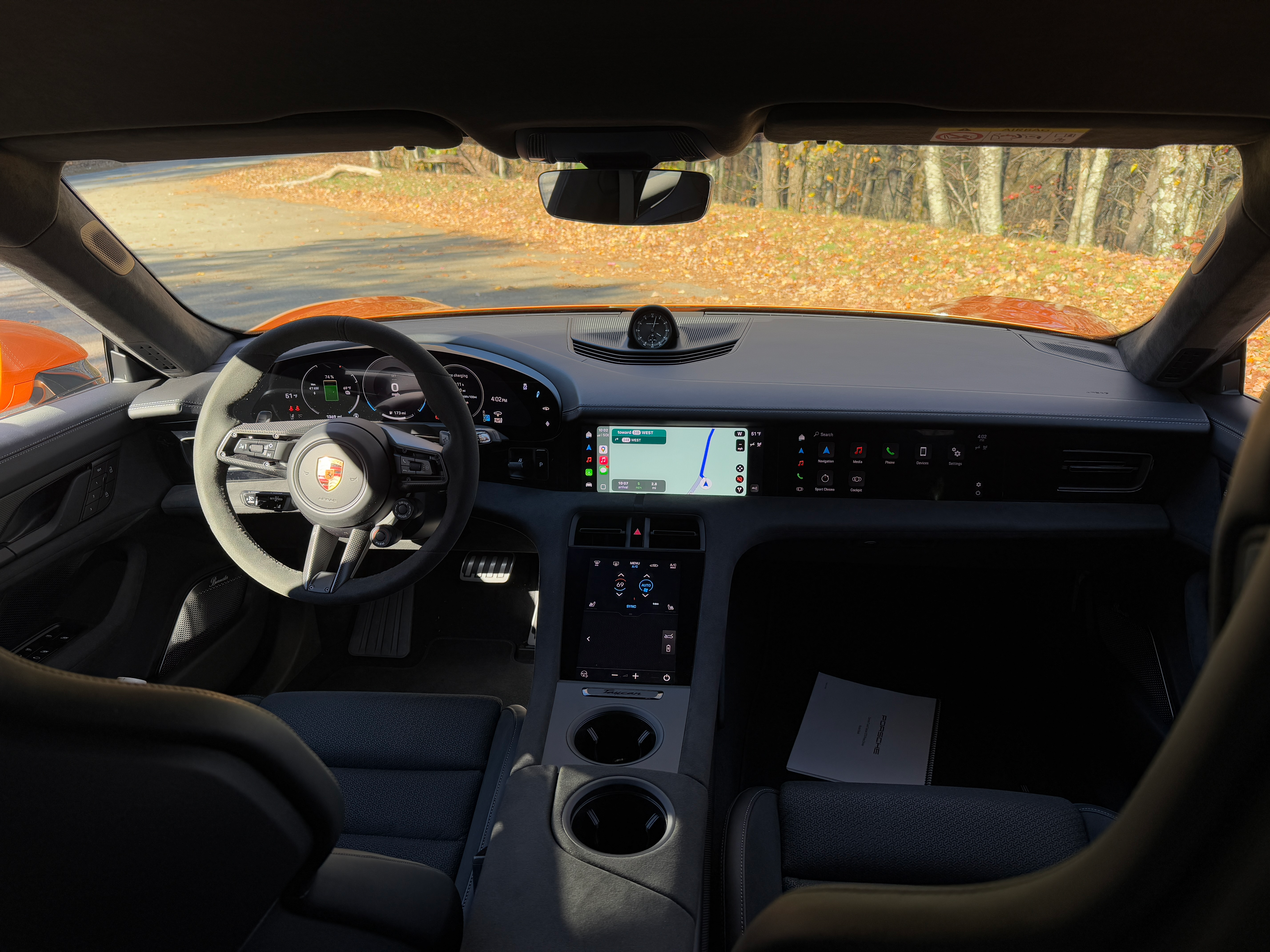 Interior of a Nordic Gold 2025 Porsche Taycan GTS sedan