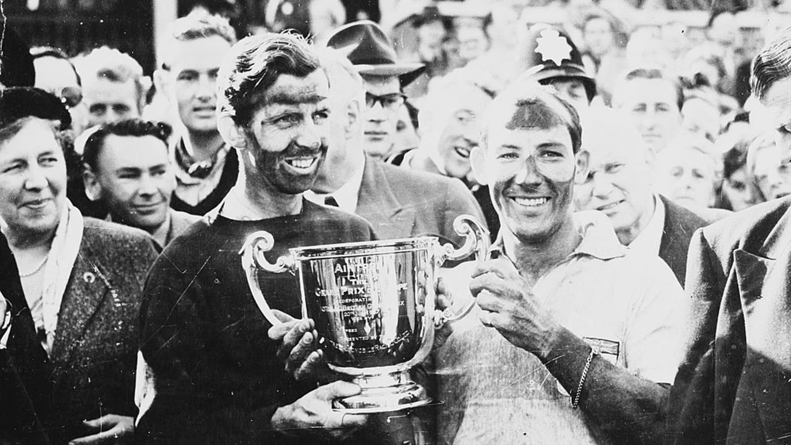 A photo of Ton y Brooks and Stirling Moss after winning the British Grand Prix.