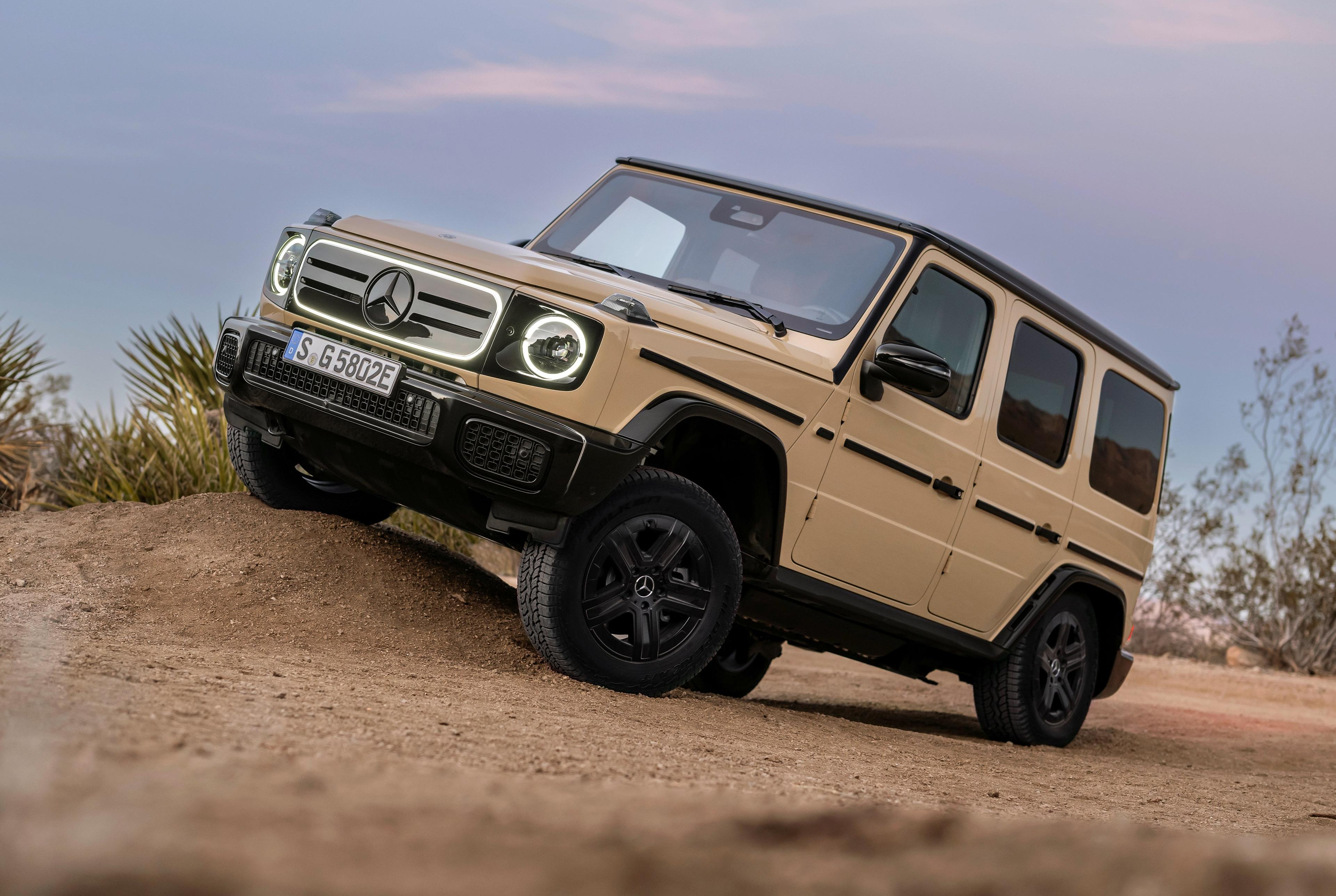 Front 3/4 view of a beige 2025 Mercedes-Benz G580 EV