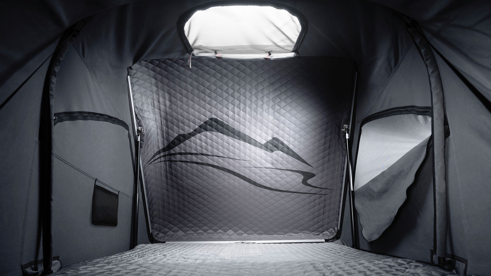 A photo of the interior of the Porsche Roof Top Tent. 