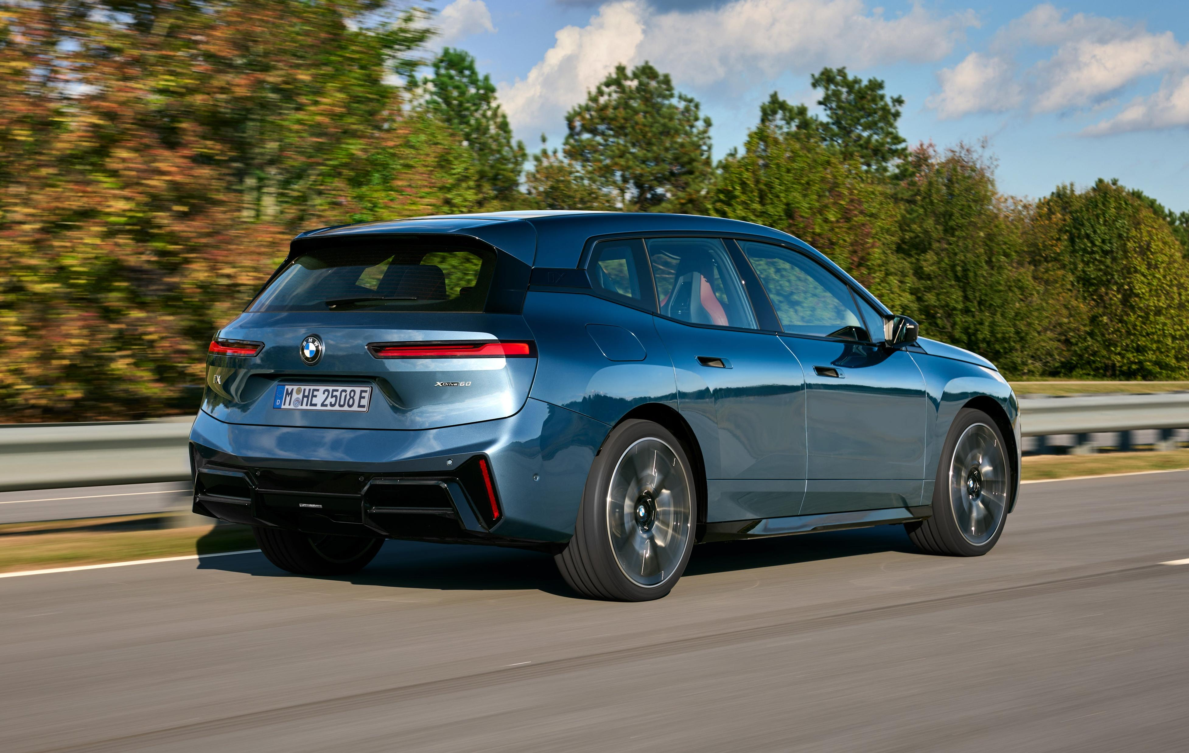 Rear 3/4 view of a blue BMW iX