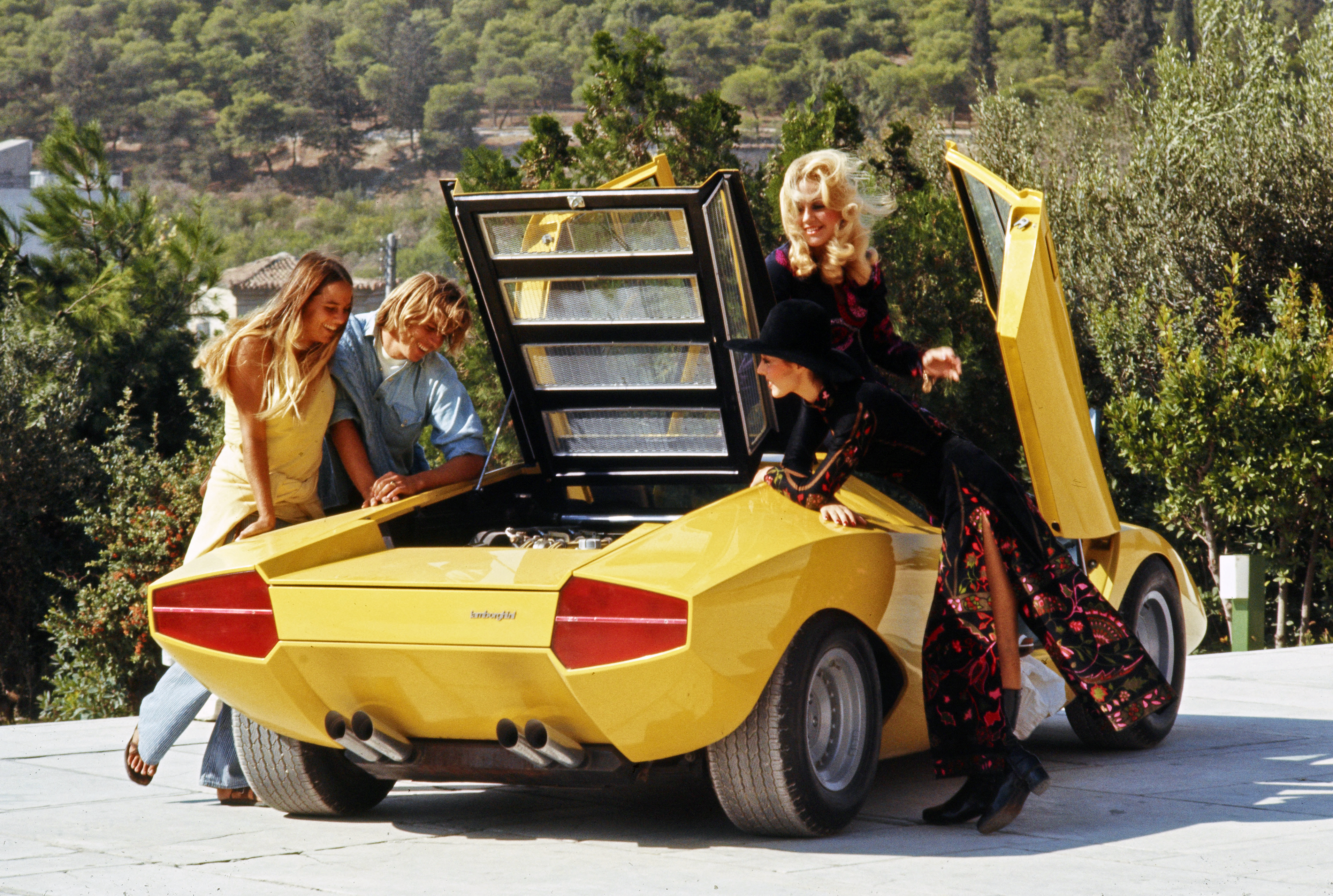 Rear 3/4 view of the yellow Lamborghini Countach LP500