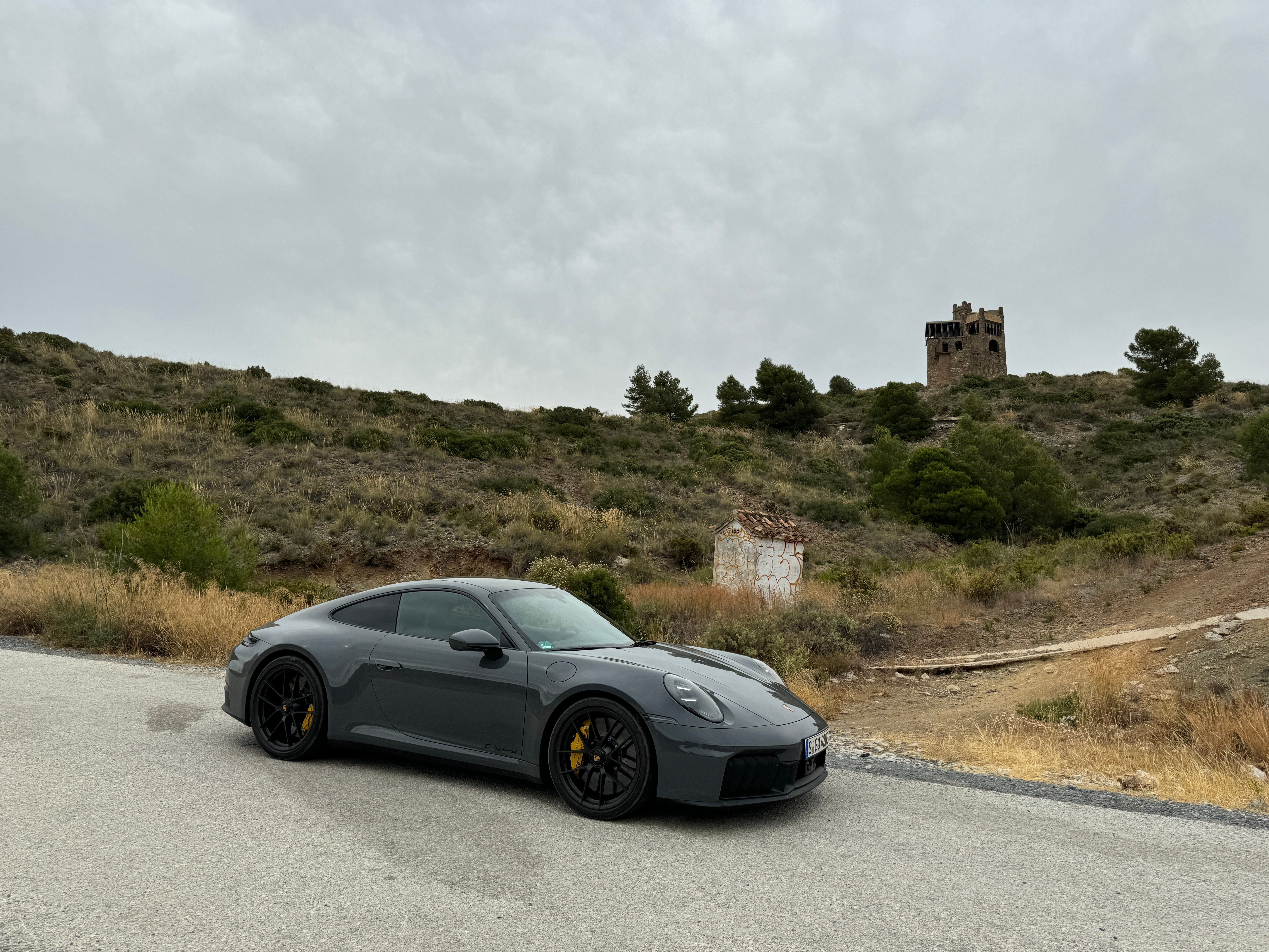 Front 3/4 view of a grey 2025 Porsche 911 Carrera GTS