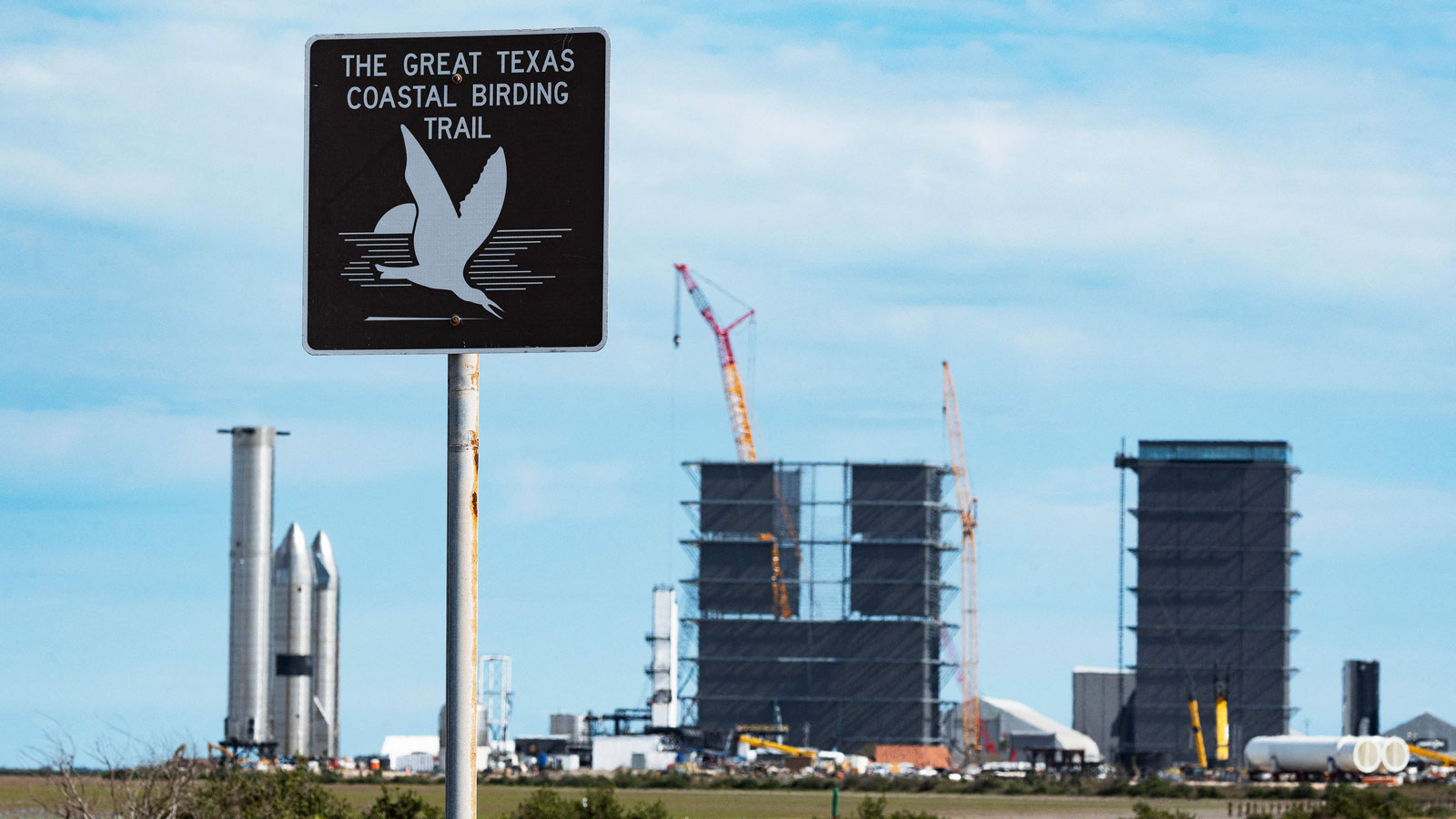 A bird conservation sign stands near SpaceX's Starbase facility near Boca Chica Village in South Texas.