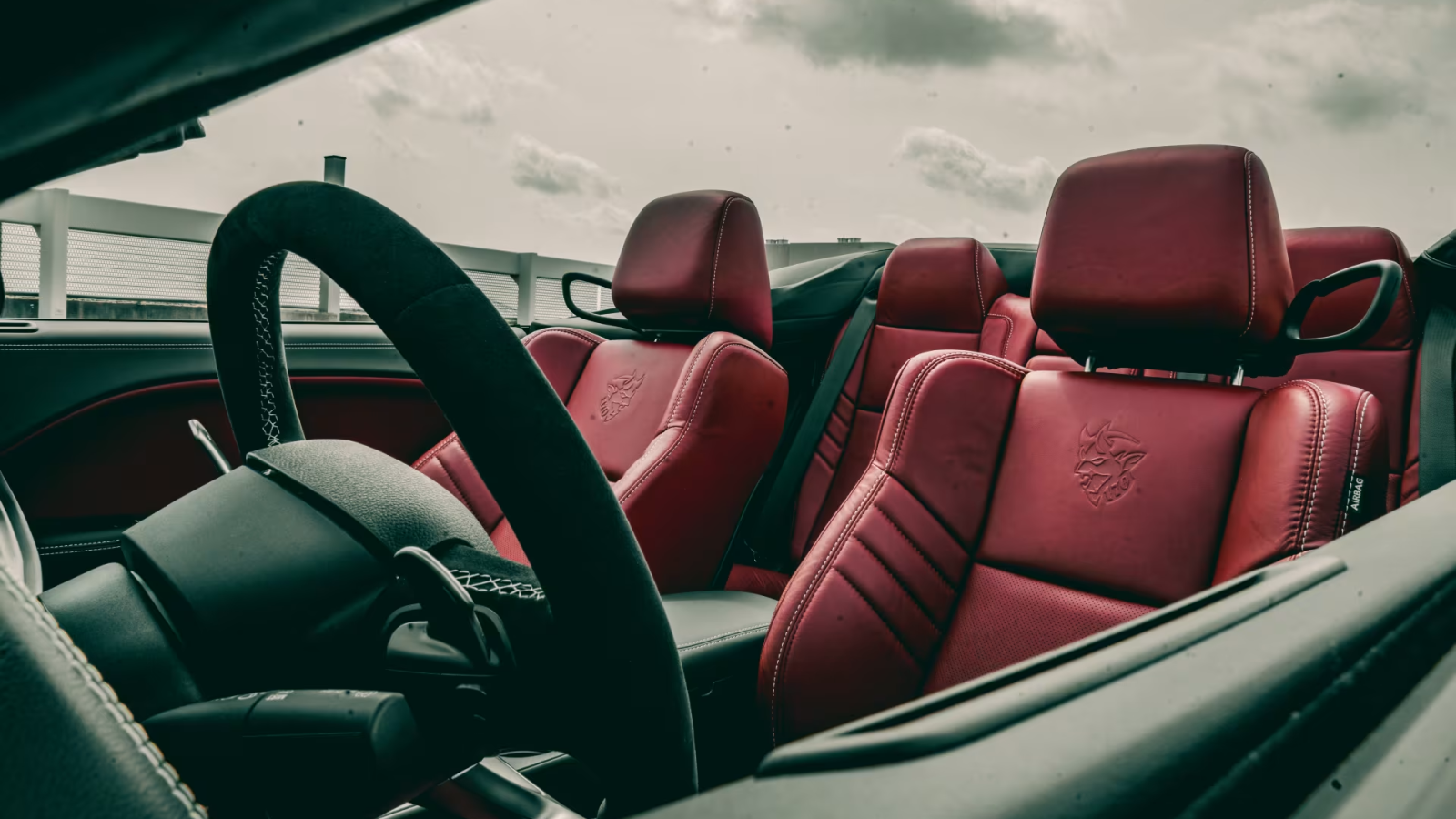 A photo of the interior in a convertible Dodge Demon 170. 