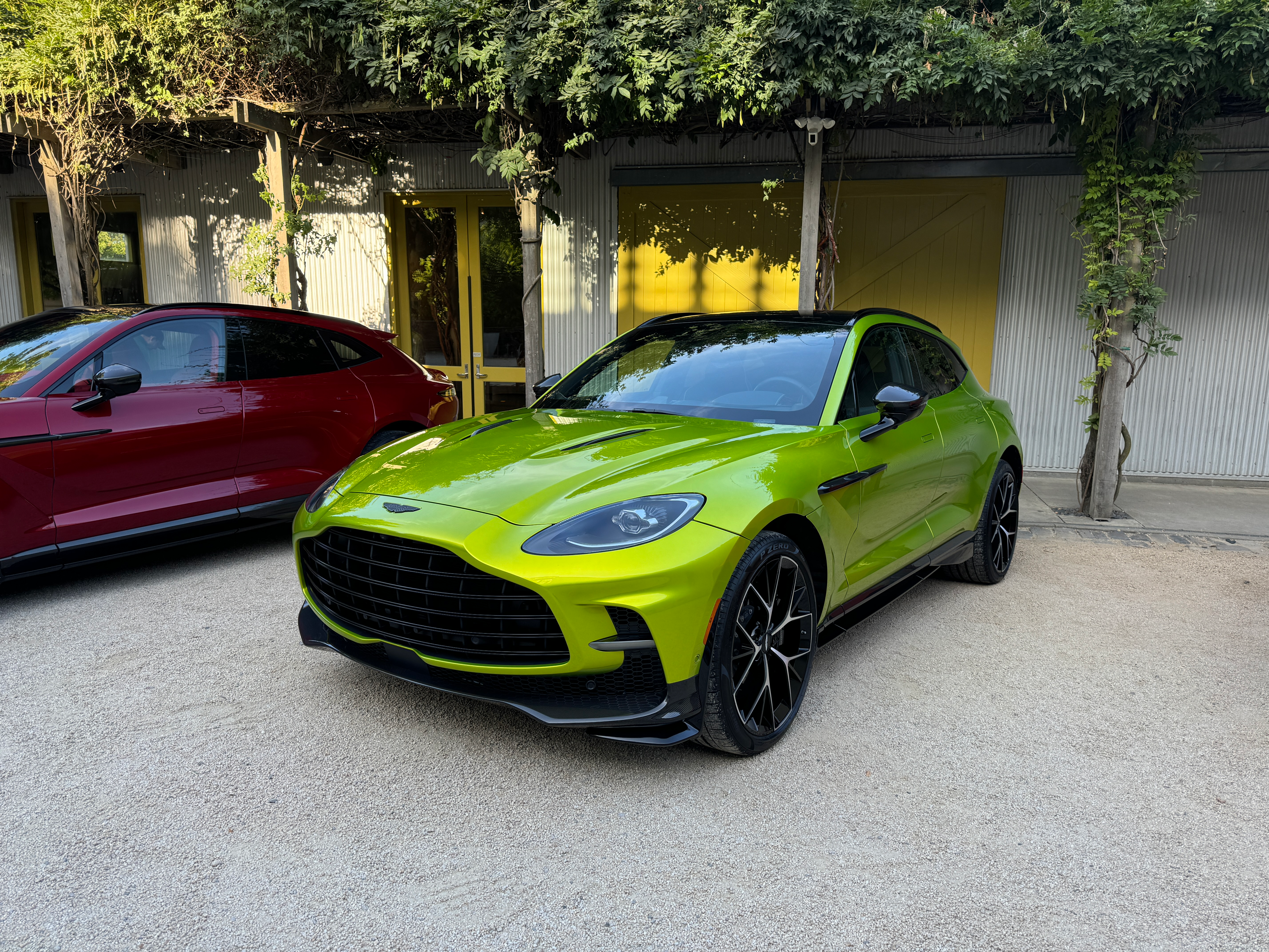 Front 3/4 view of a lime green Aston Martin DBX707