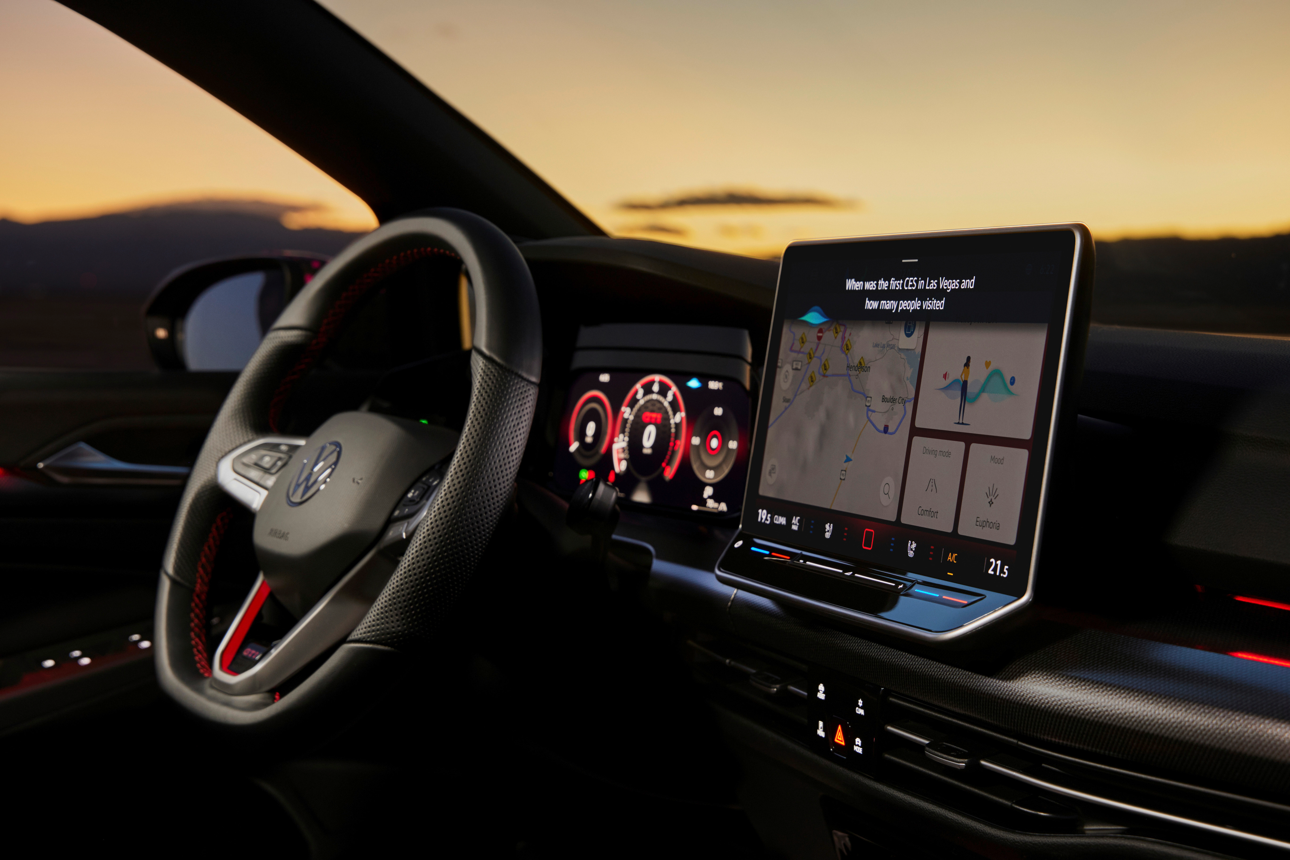 The interior of the new GTI featuring the upgraded infotainment system and steering wheel with real buttons.