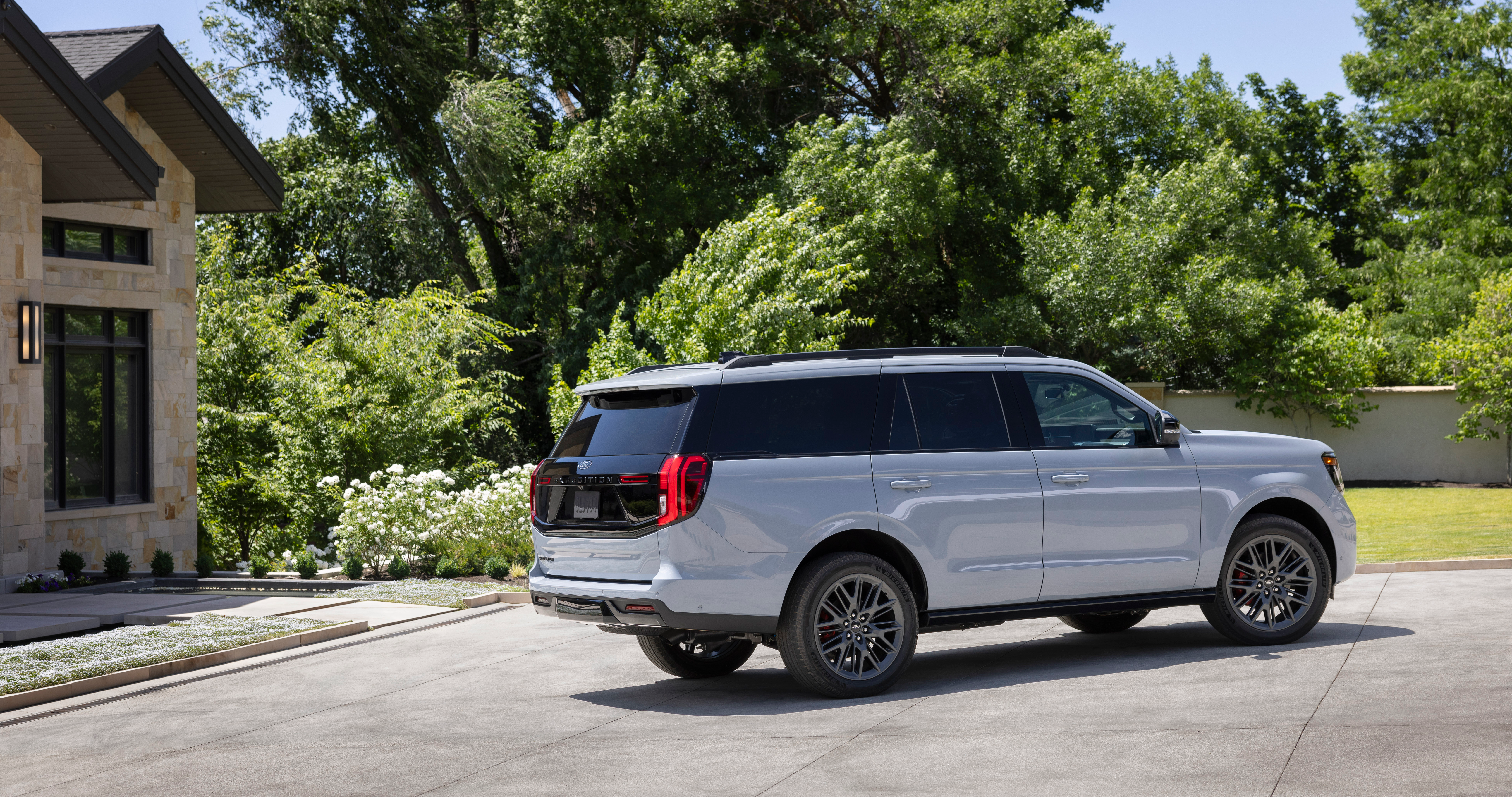 A photo of an Expedition Stealth model parked in front of a home