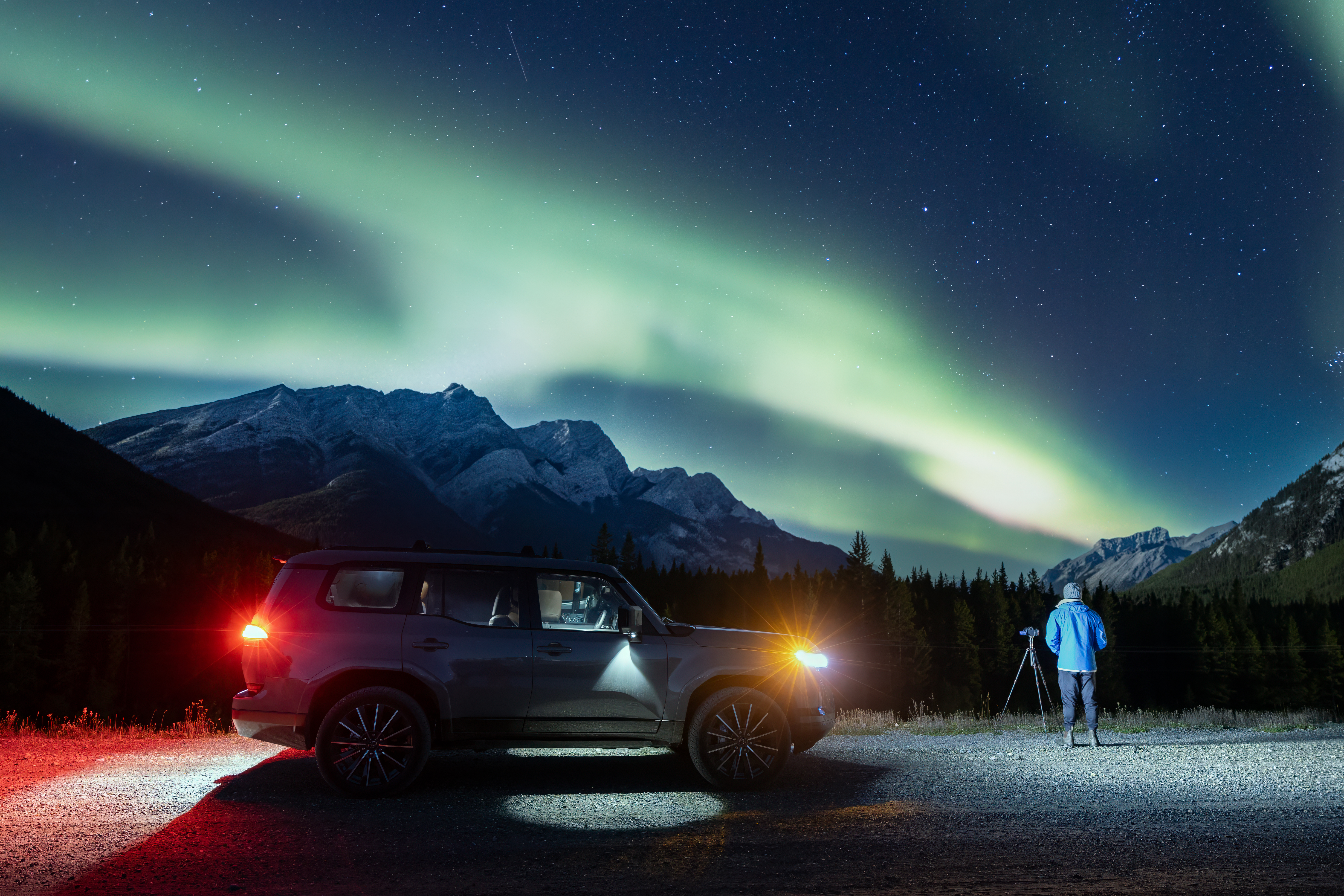 Side view of a Lexus GX 550 with the northern lights in the background