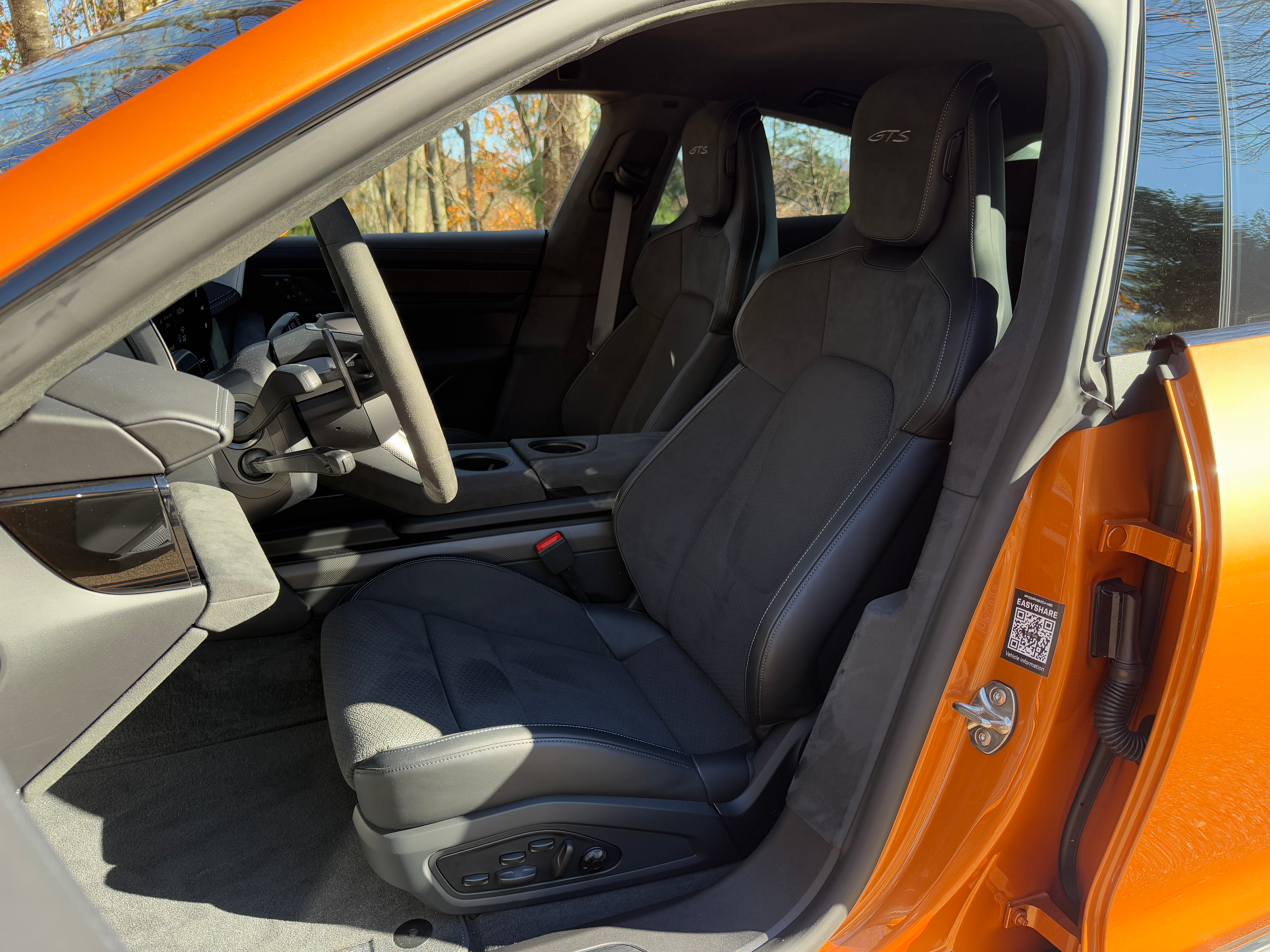 Front seat of a Nordic Gold 2025 Porsche Taycan GTS sedan