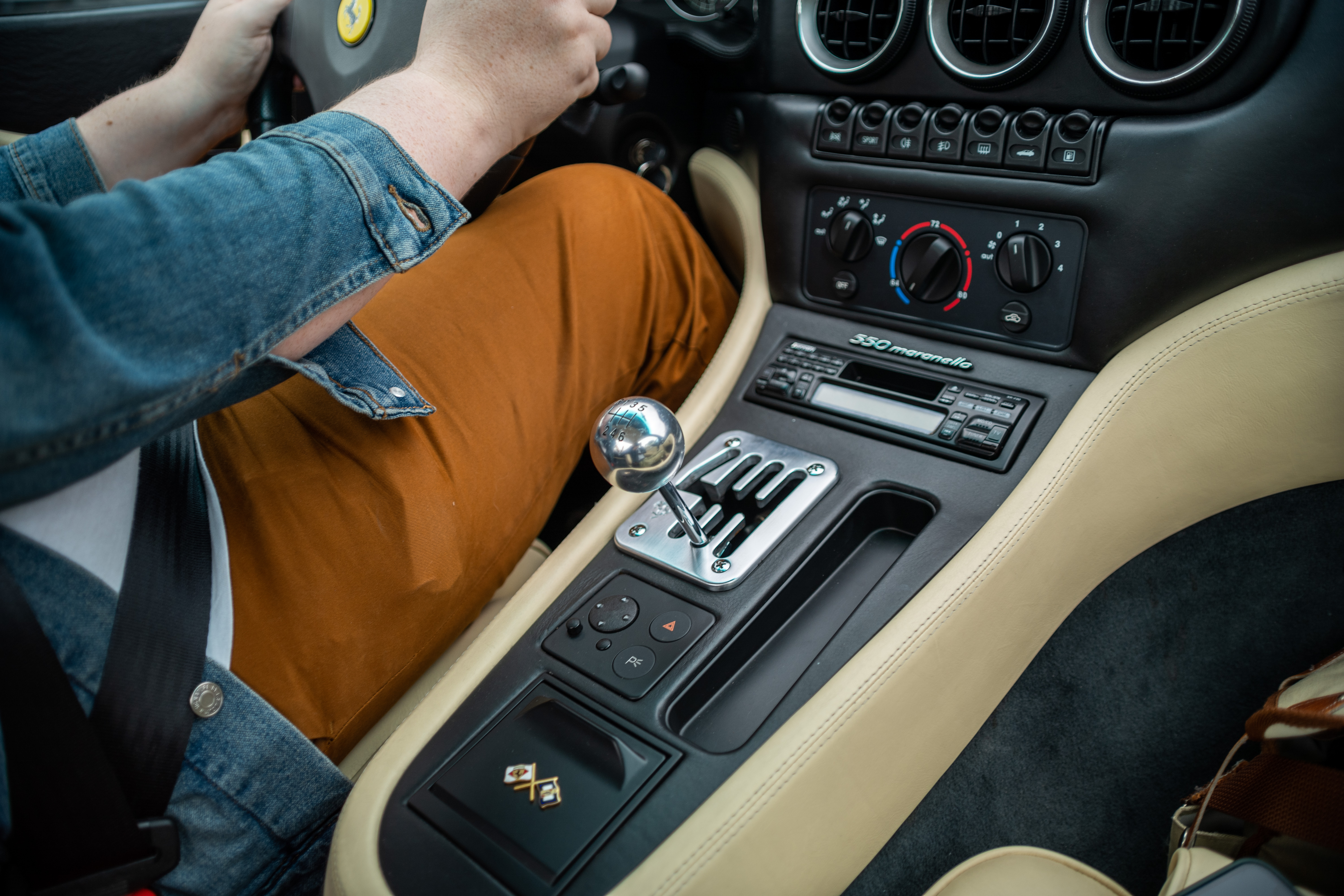 The center console and gear stick of a 1999 Ferrari 550 Maranello