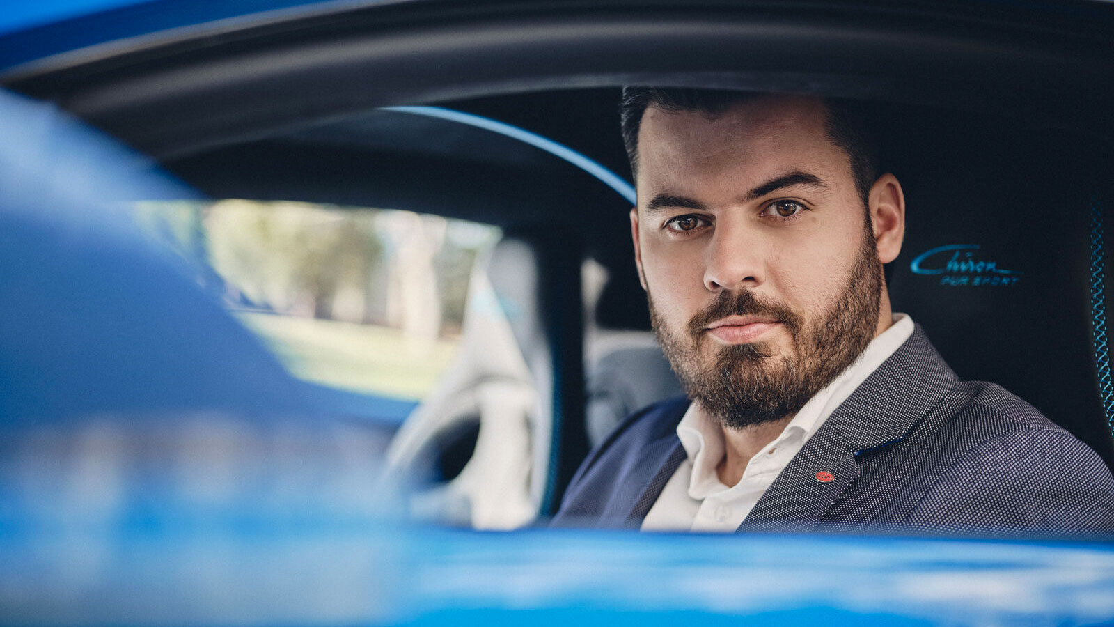 A photo of Bugatti CEO Mate Rimac sat in a Chiron. 