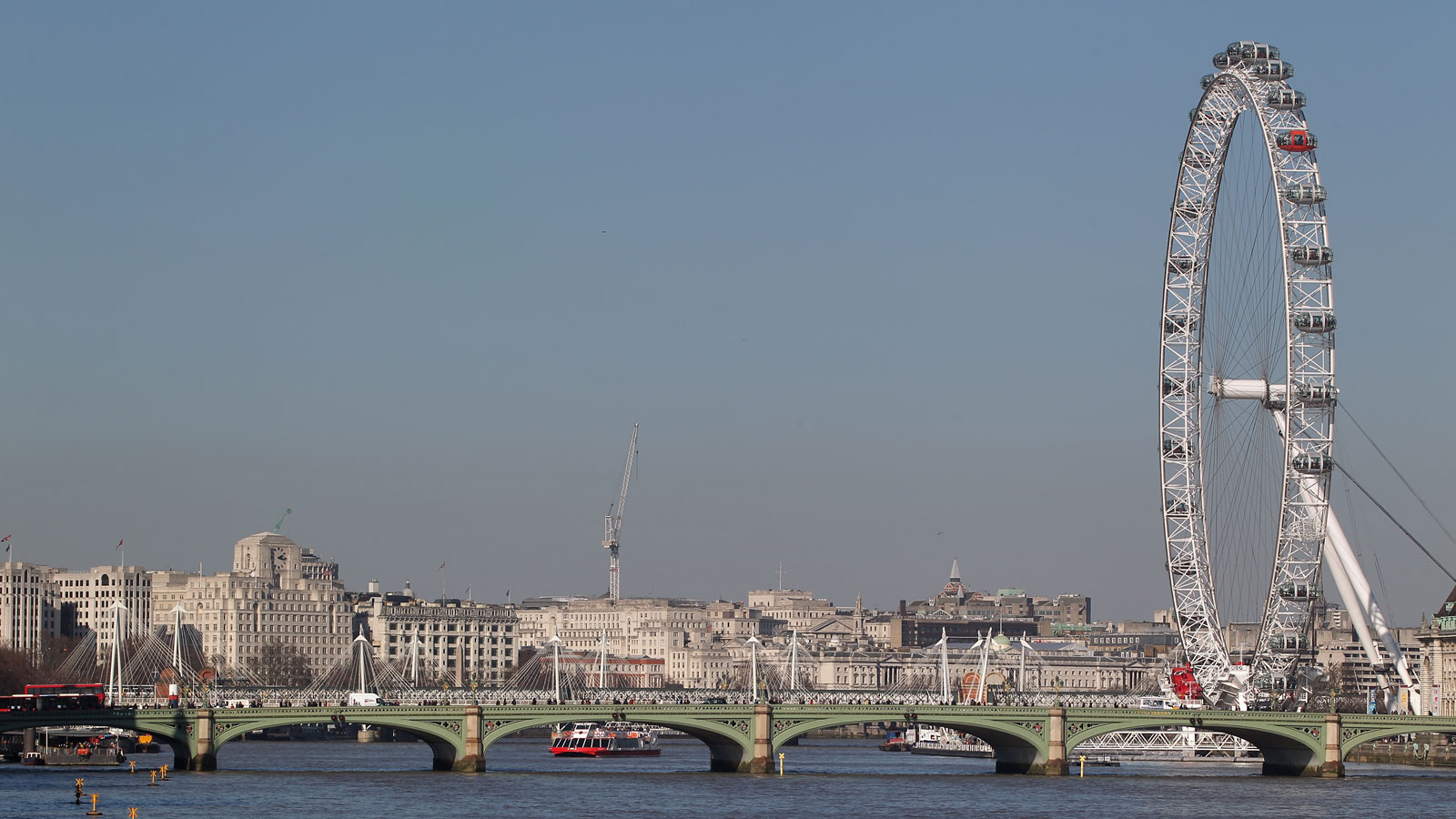 A photo of central London including the London Eye and Westminster Bridge 