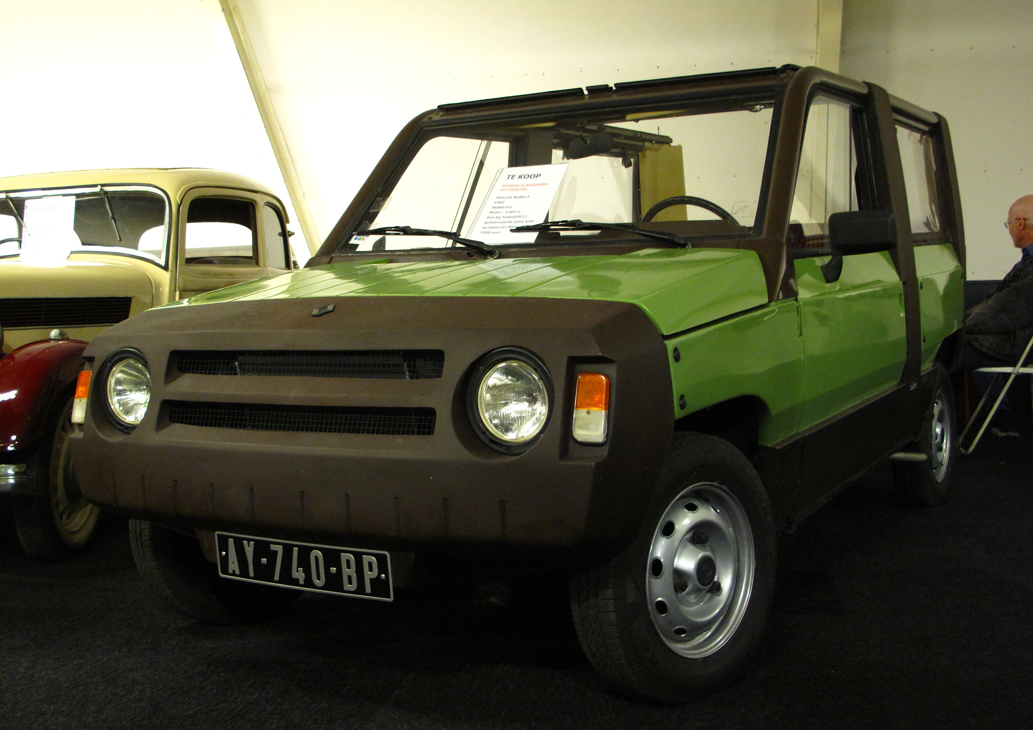 A bright green Renault Rodeo 5 parked inside 