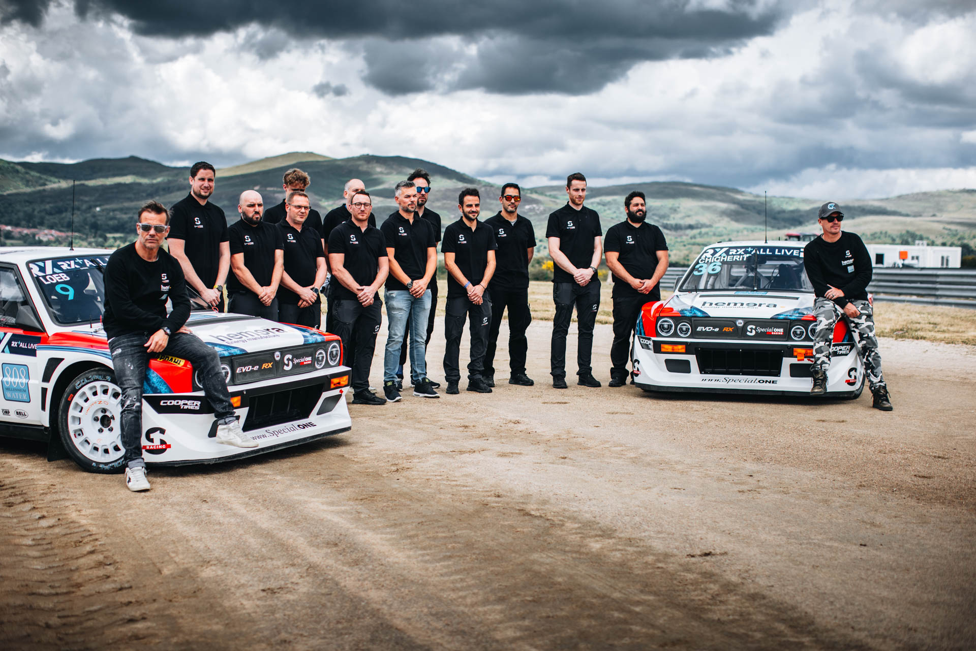 A photo of the Special One racing team posing with its two Delta Evo-e cars.