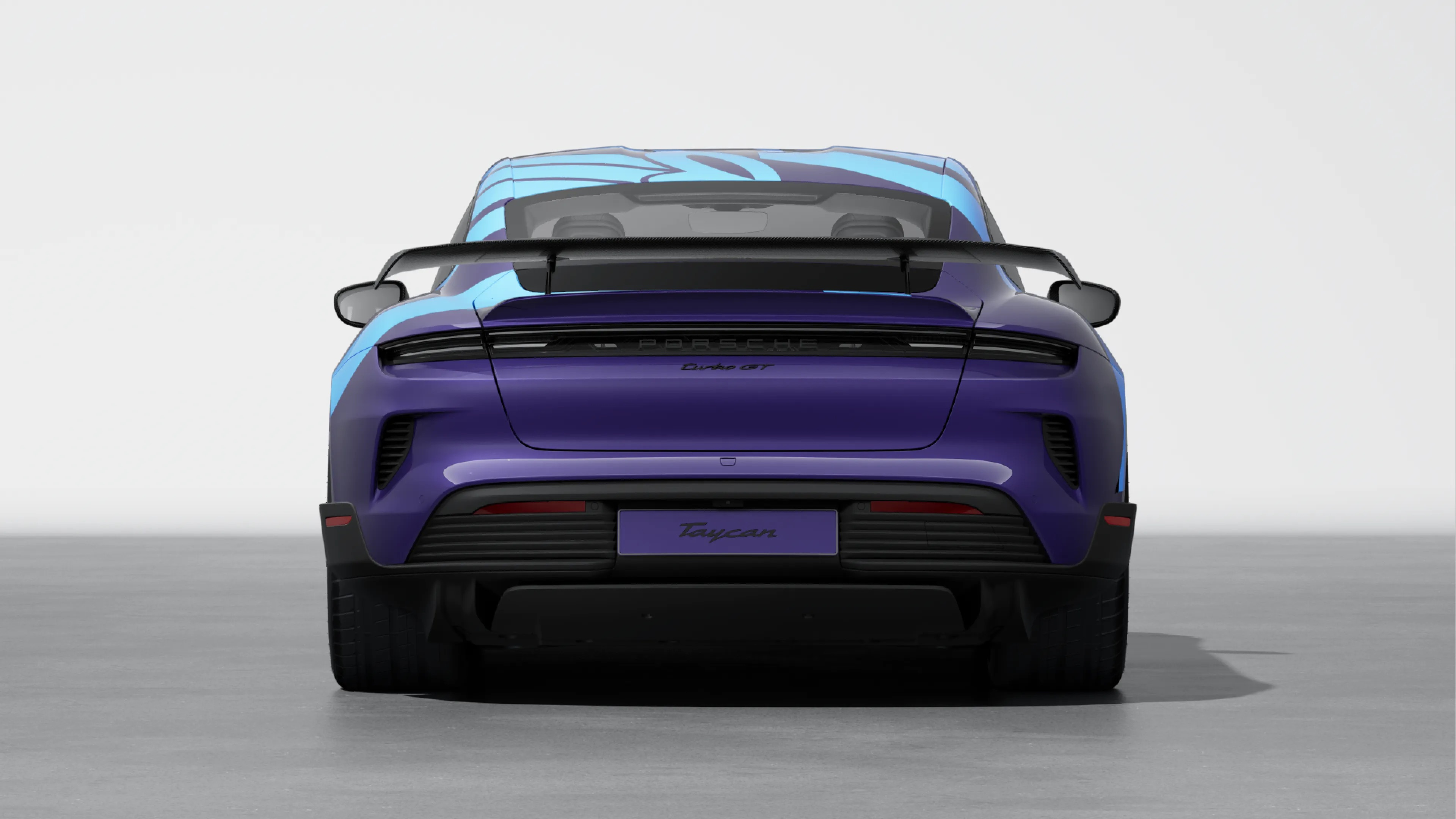 Rear view of a purple Porsche Taycan Turbo GT with a bright blue livery