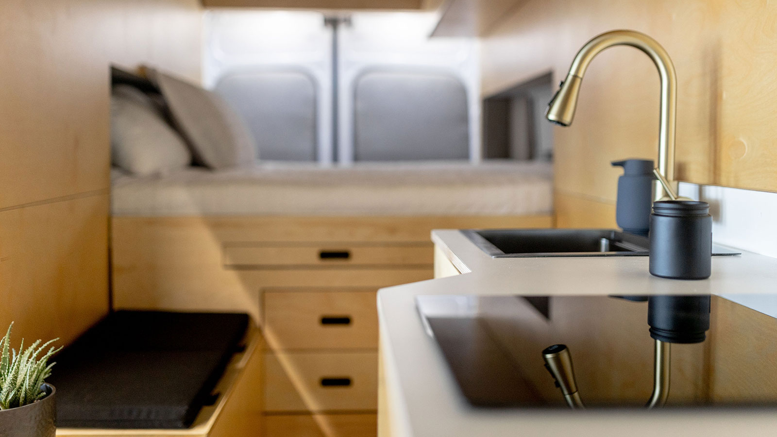 A photo of the kitchen inside the electric camper. 