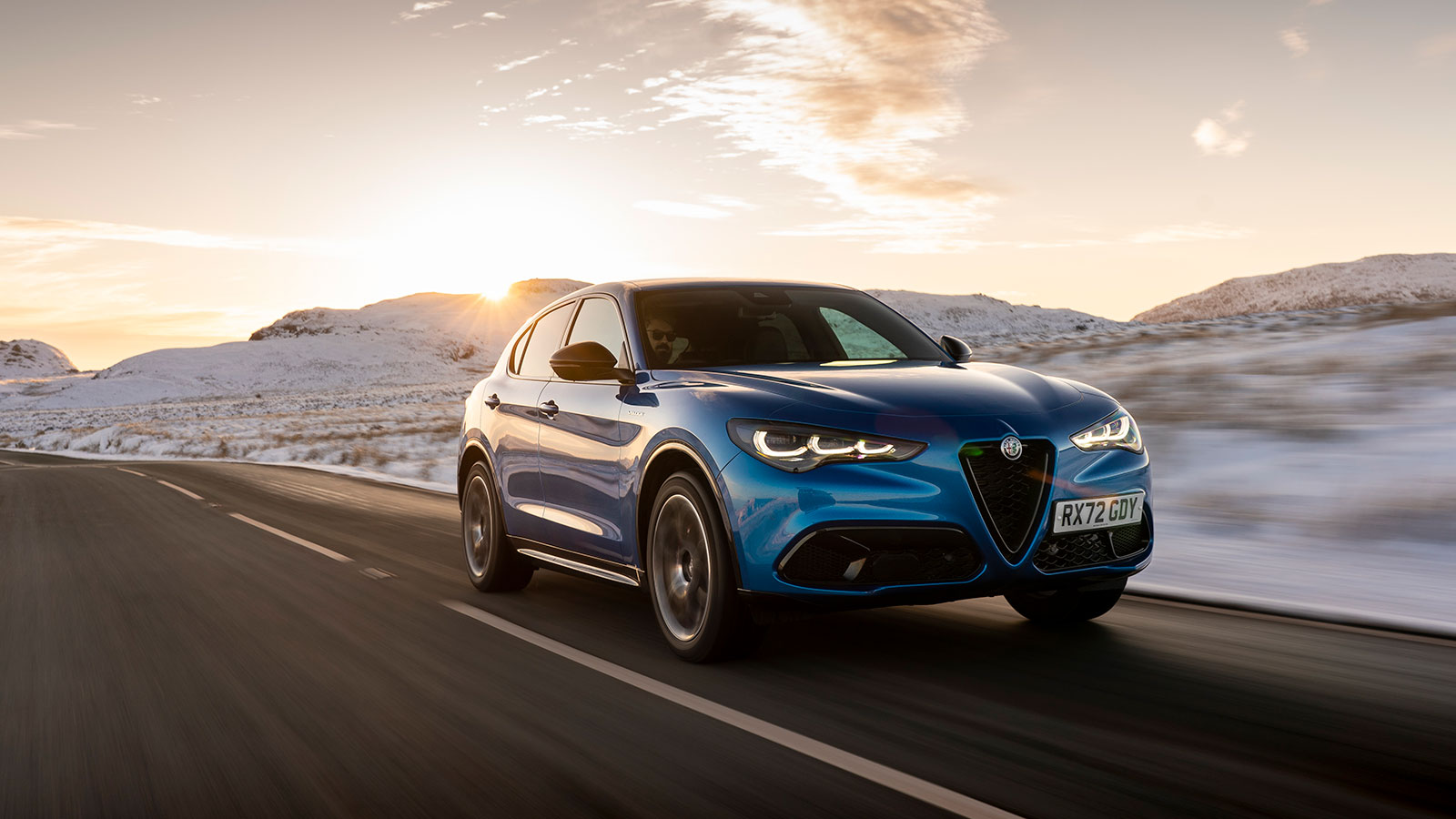 A photo of a blue Alfa Romeo Stelvio SUV. 