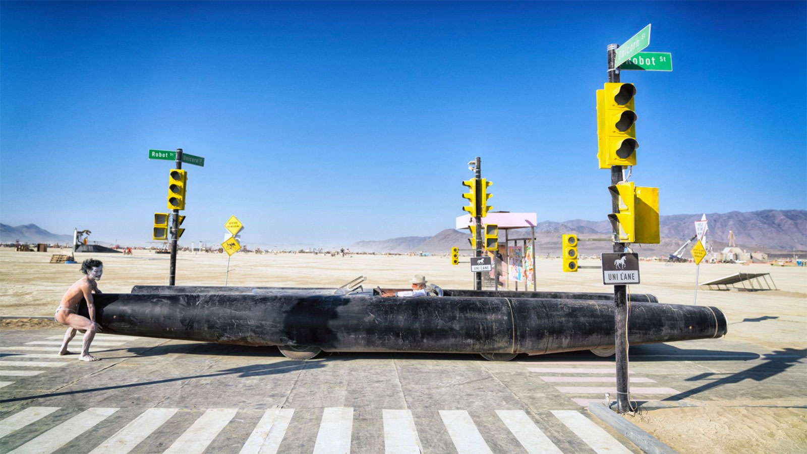 A photo of the Rocket Car crossing a traffic intersection in the desert