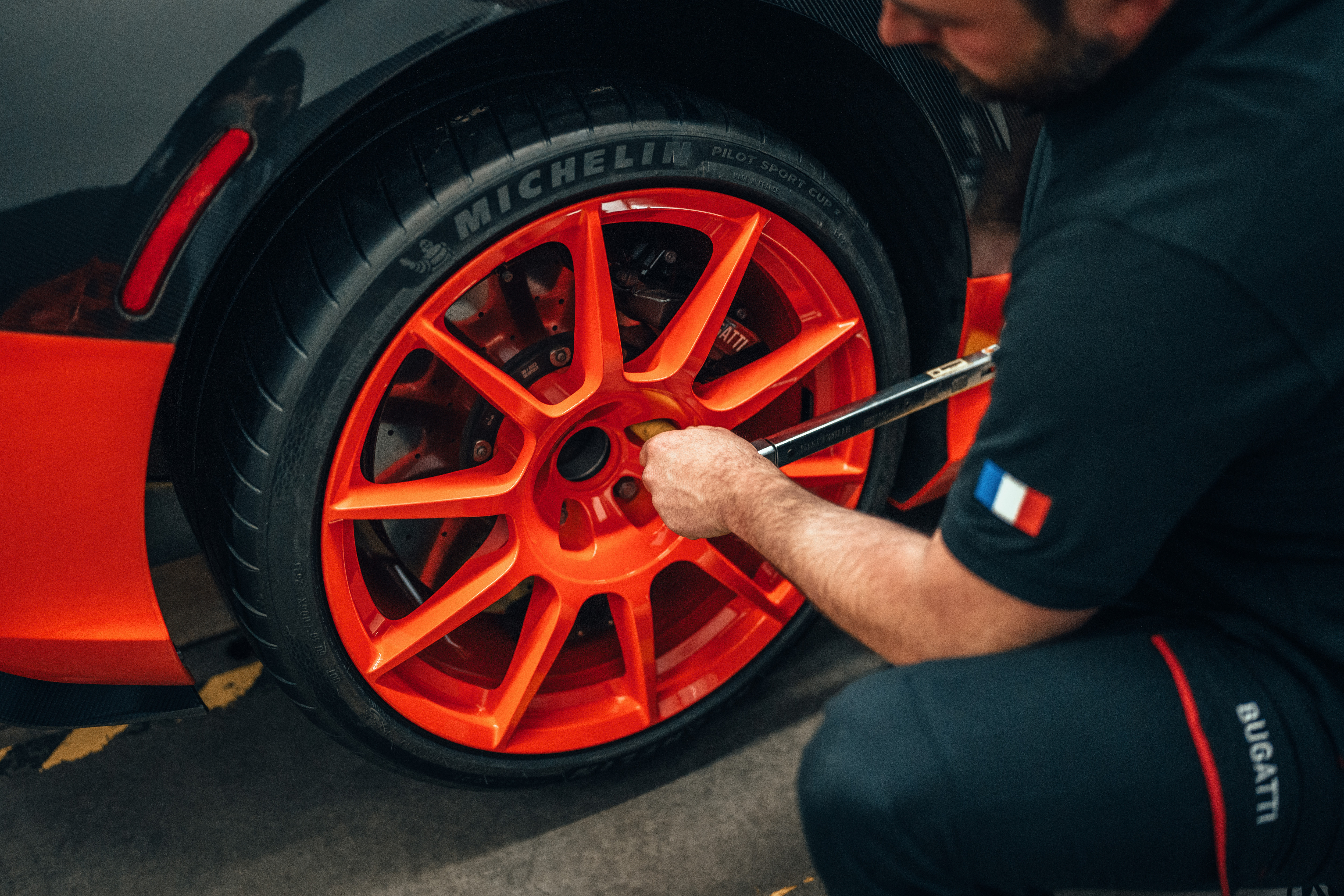 Rear wheel of the black and orange Bugatti W16 Mistral World Record Car