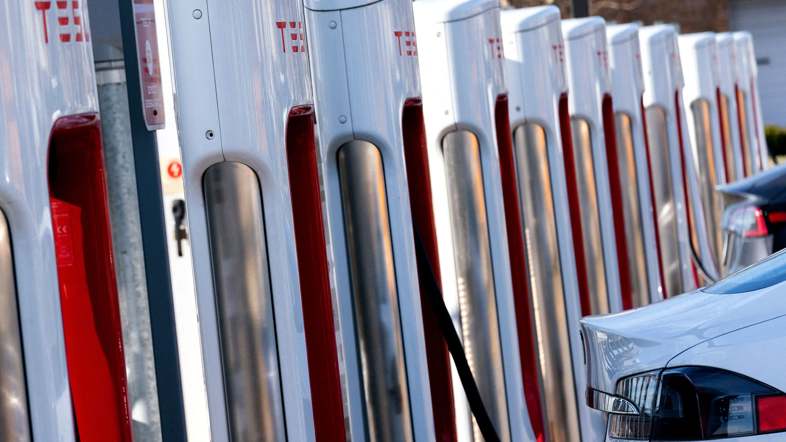 A photo of a lineup of Tesla Superchargers. 