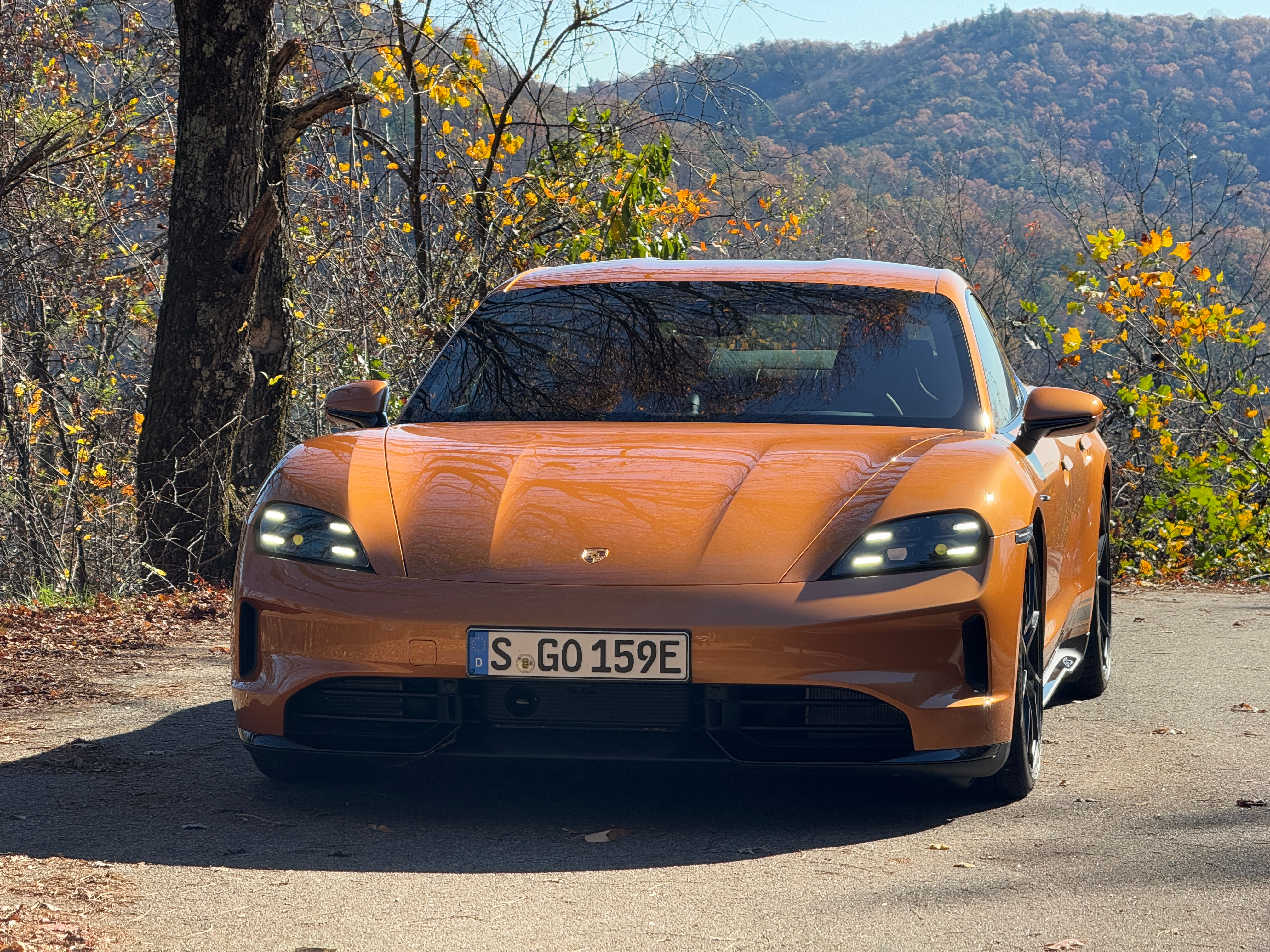 Front end of a Nordic Gold 2025 Porsche Taycan GTS sedan