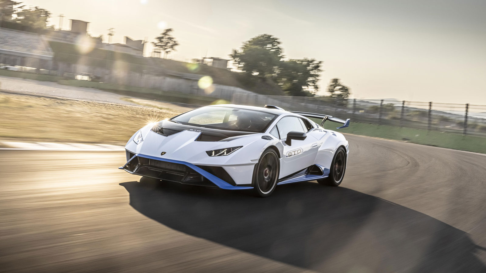 A photo of a high performance Lamborghini Huracan supercar on the track. 