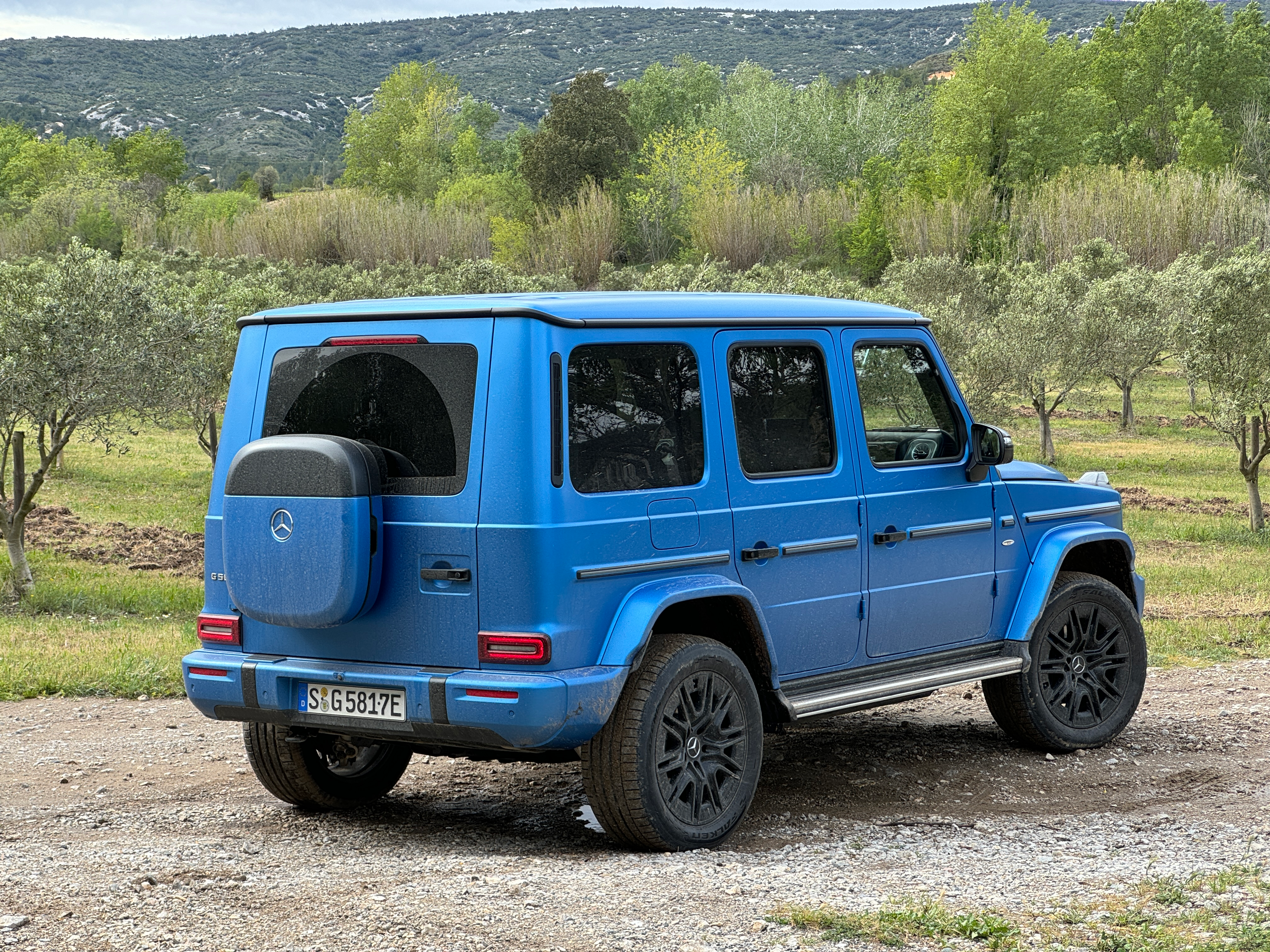 Rear 3/4 view of a blue Mercedes-Benz G580 EV