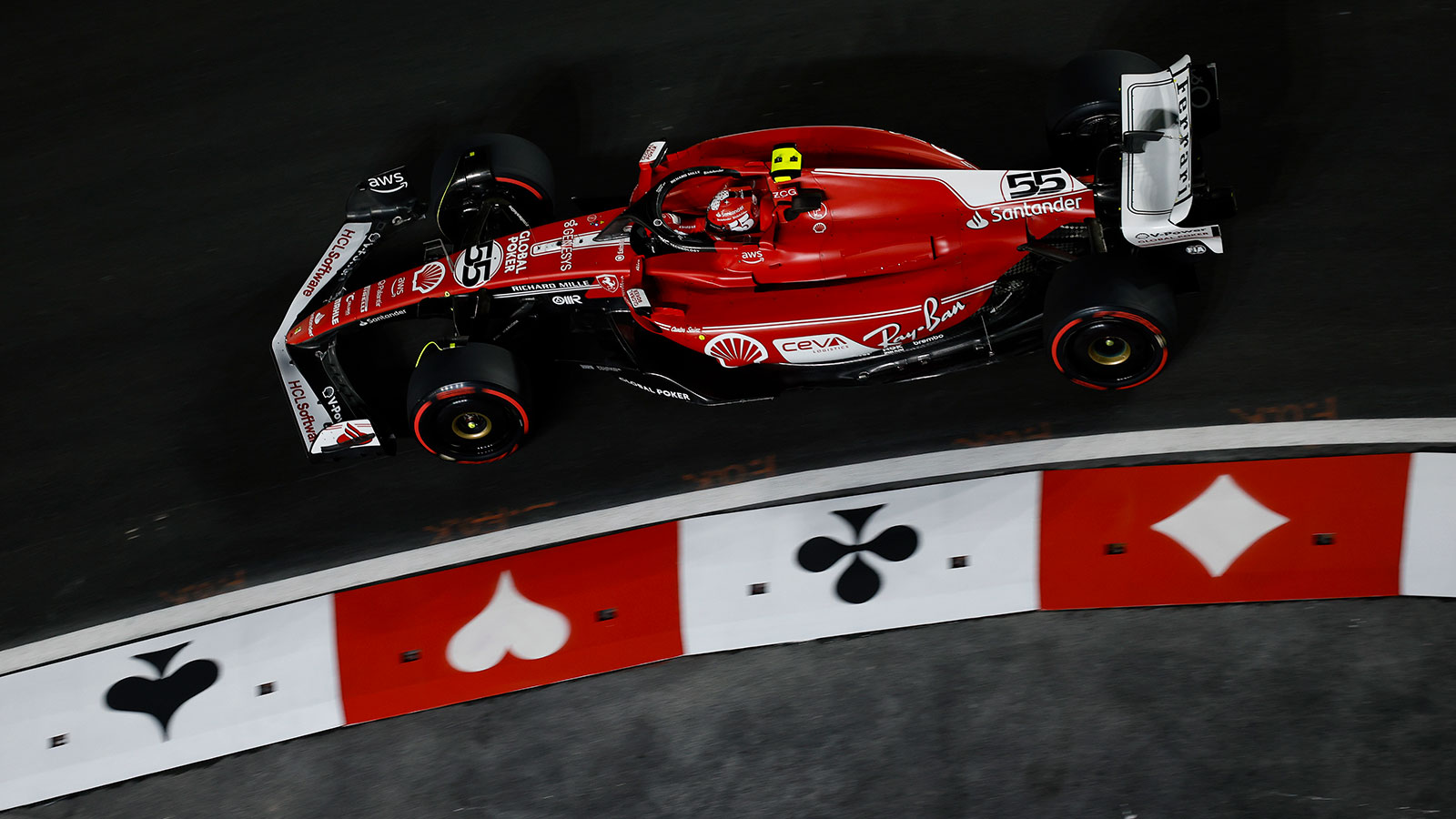 A photo of Carlos Sainz driving his Ferrari in Las Vegas. 