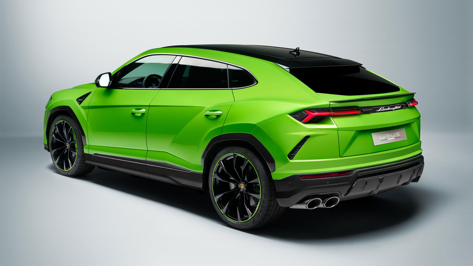 An image of a green Lamborghini Urus SUV. 