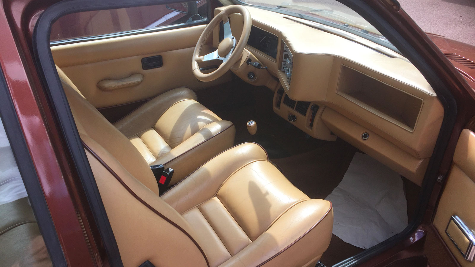 The tan leather interior of the Frazer-Tickford Metro