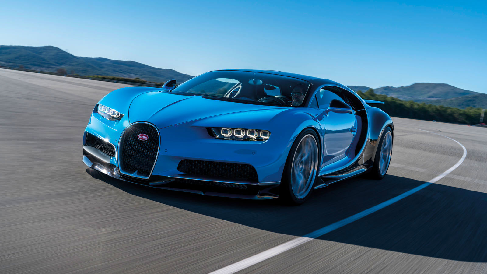 A photo of a blue Bugatti Chiron hypercar