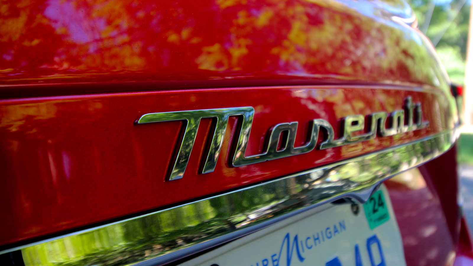 A photo of the Maserati emblem on the back of the Ghibli. 