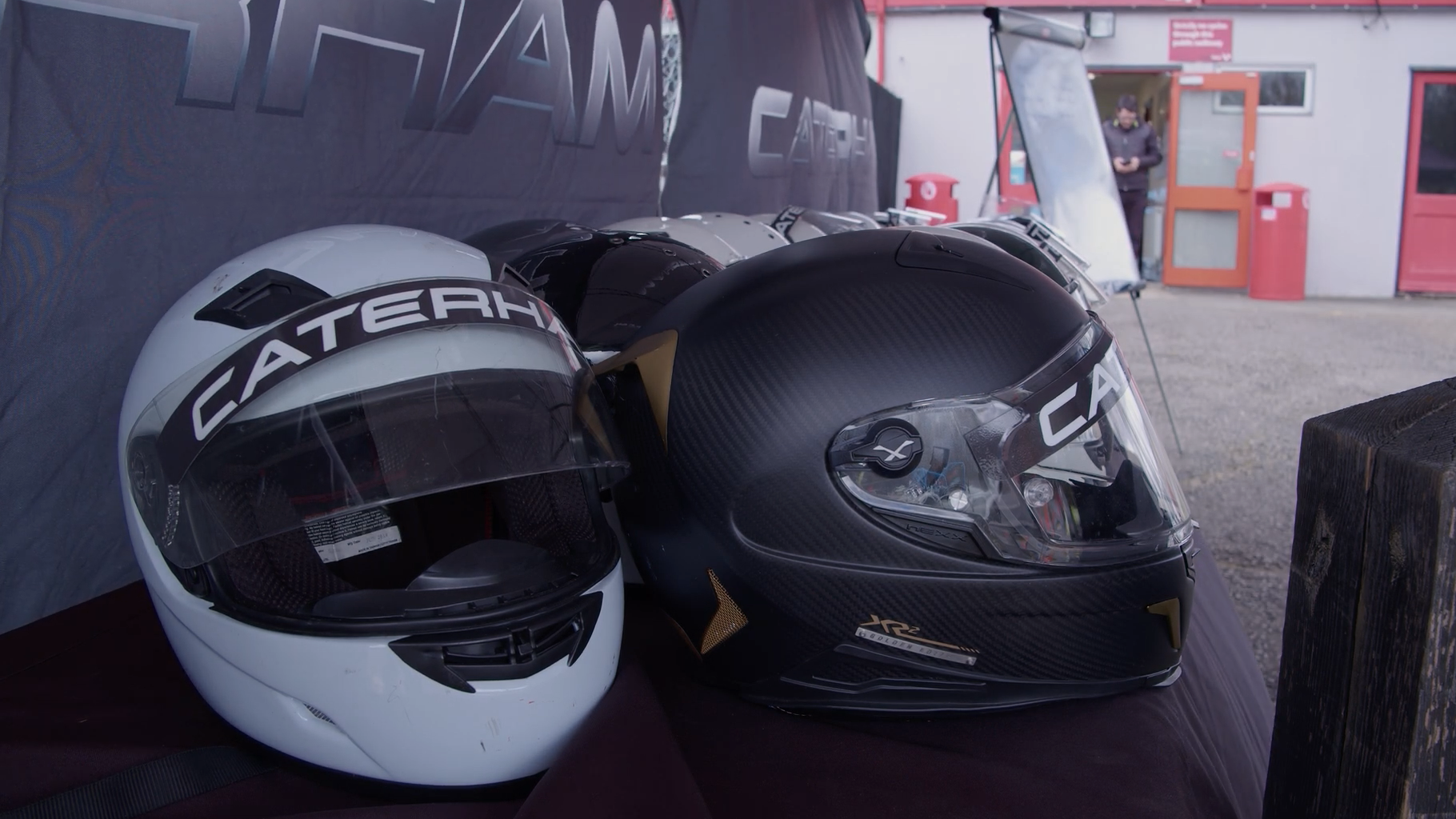 A photo of a pile of Caterham helmets. 