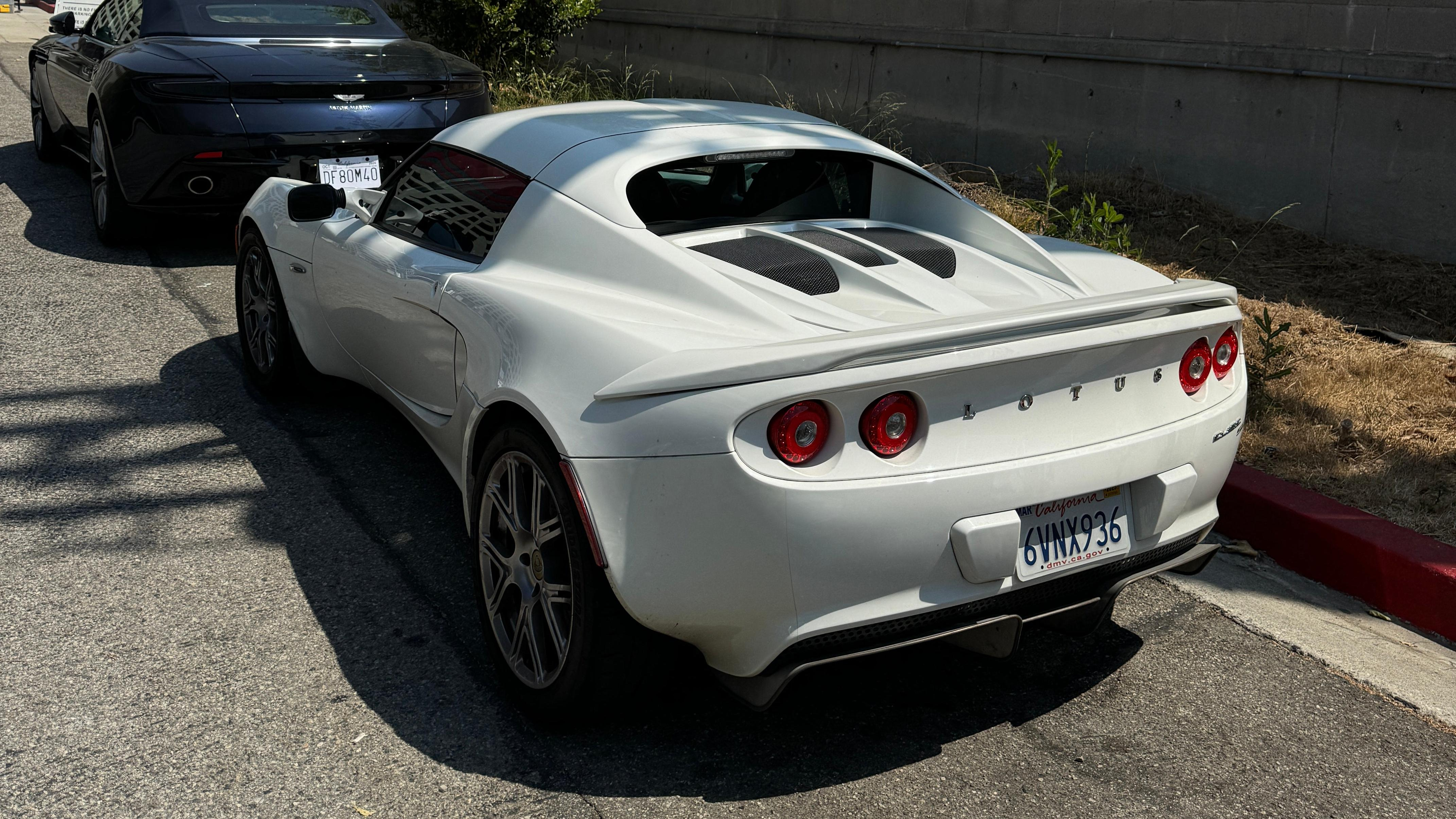 Rear 3/4 view of a white 2011 Lotus Elise SC