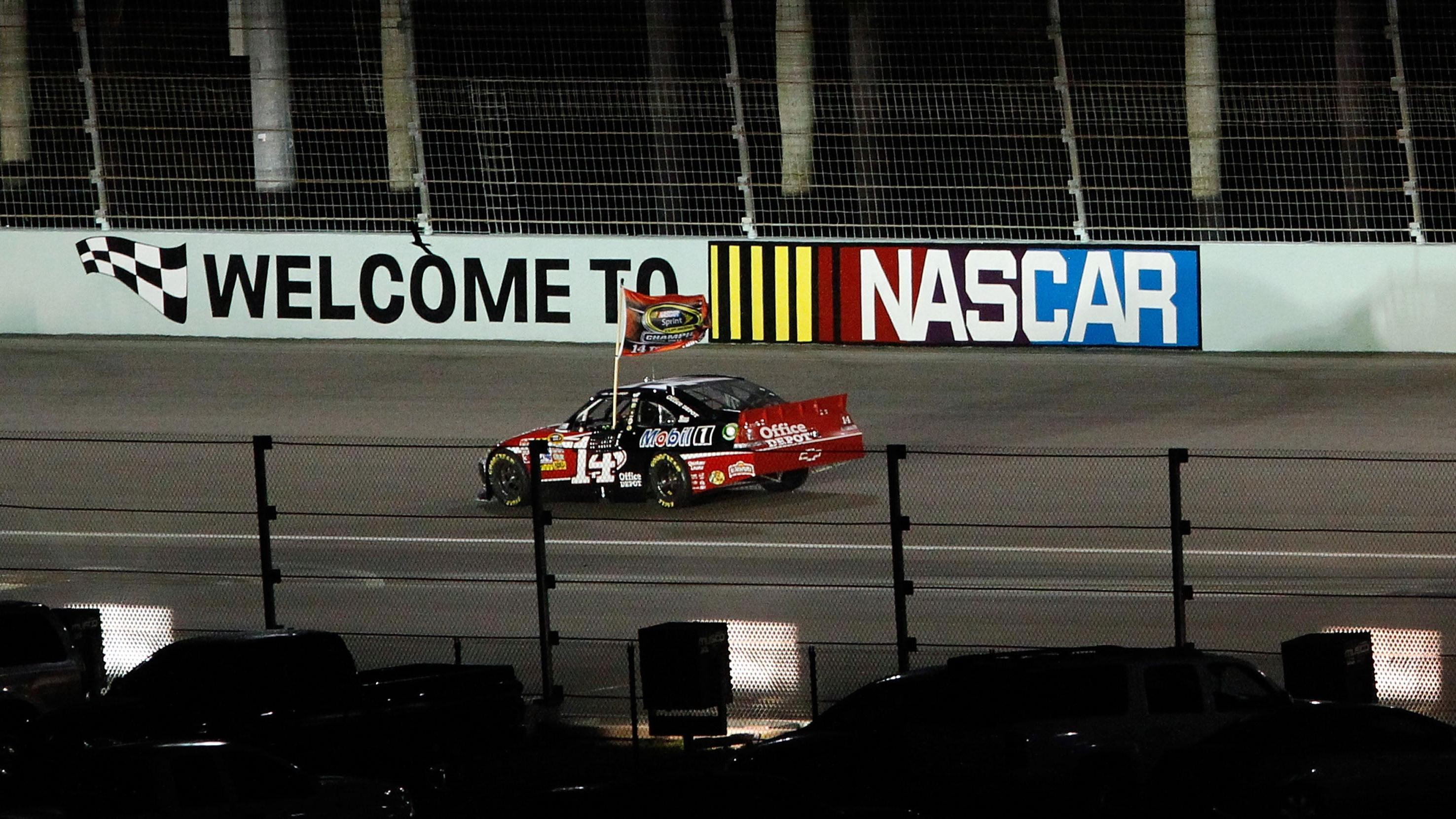 Tony Stewart, driver of the #14 Office Depot/Mobil 1 Chevrolet, celebrates after winning the NASCAR Sprint Cup Series Ford 400 and the 2011 Series Championship at Homestead-Miami Speedway on November 20, 2011 in Homestead, Florida.