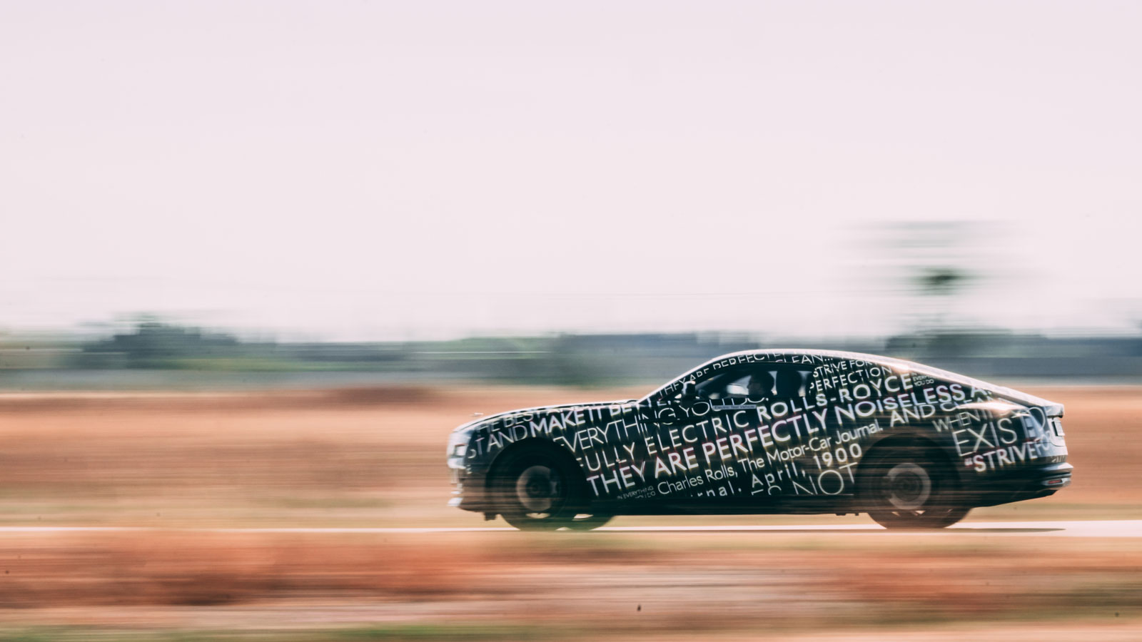 A profile photo of a Rolls Royce Spectre EV. 