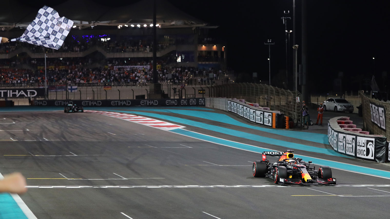 Max Verstappen crosses the line ahead of Lewis Hamilton in Abu Dhabi 