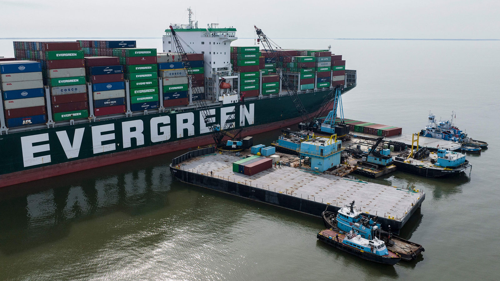 A photo of cranes unloading containers from the Ever Forward ship. 