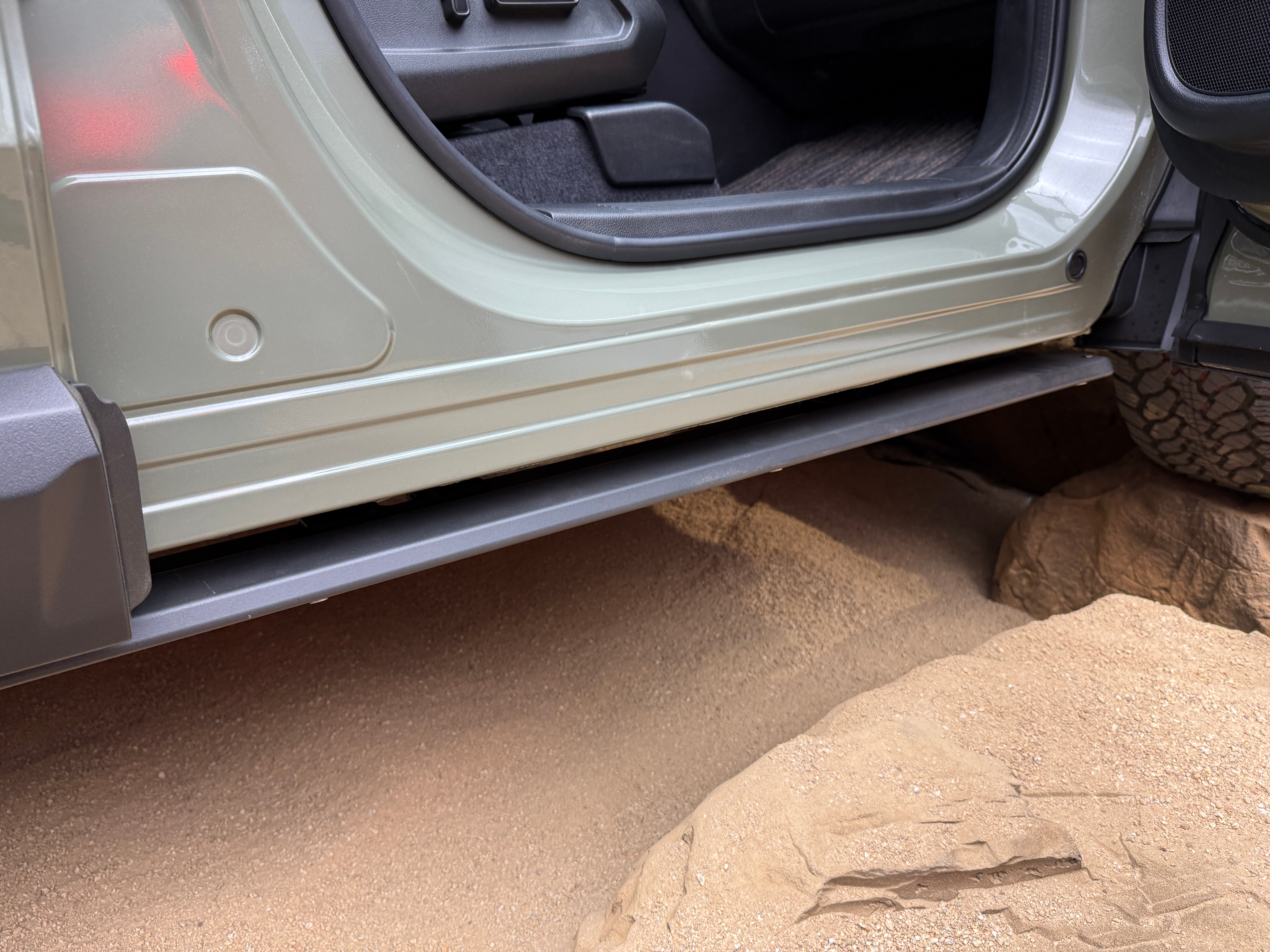 Rock rails of a green 2026 Honda Passport TrailSport