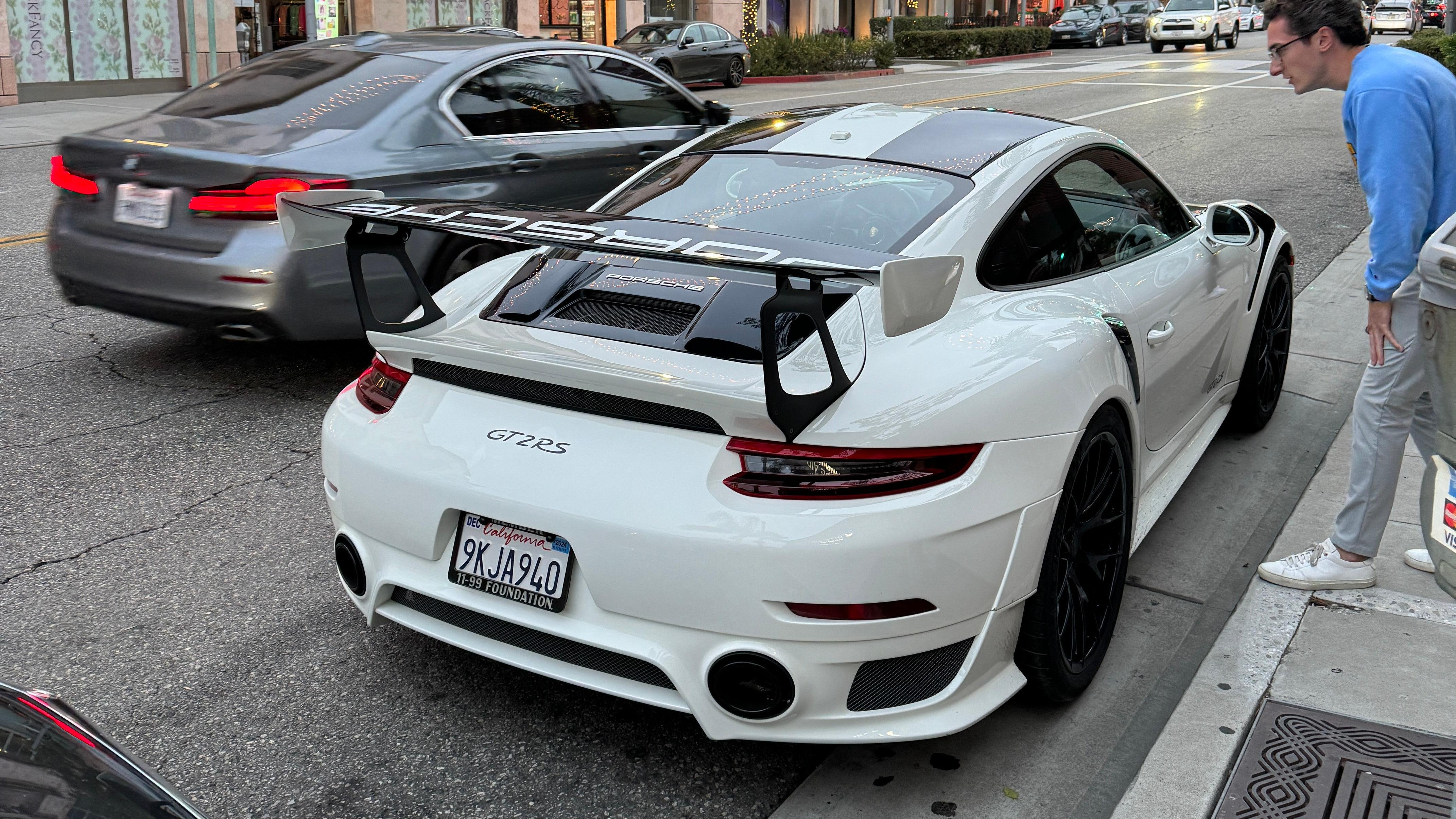 Rear 3/4 view of a white Porsche 911 GT2 RS