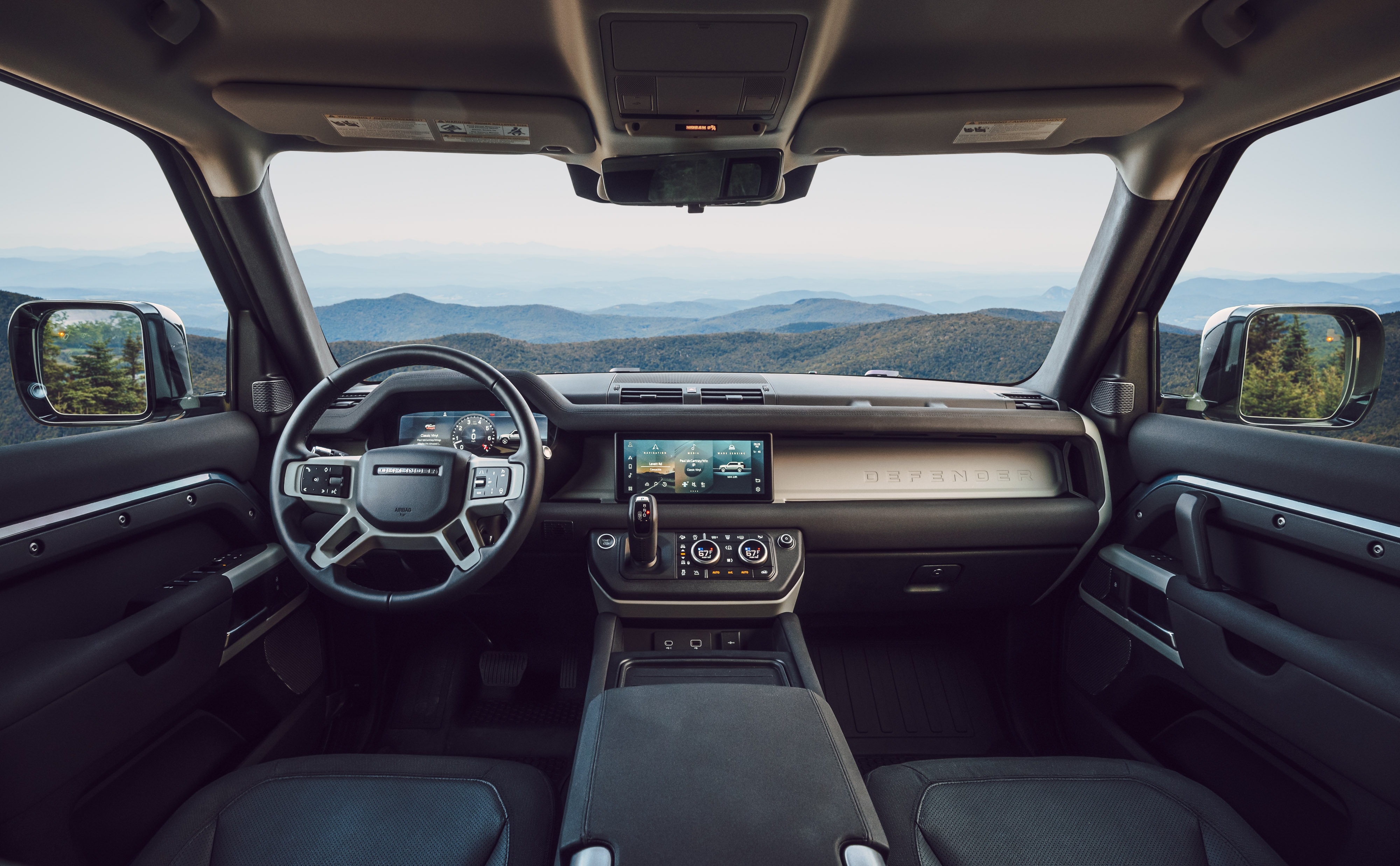 The black leather and suede interior of the Land Rover Defender 110